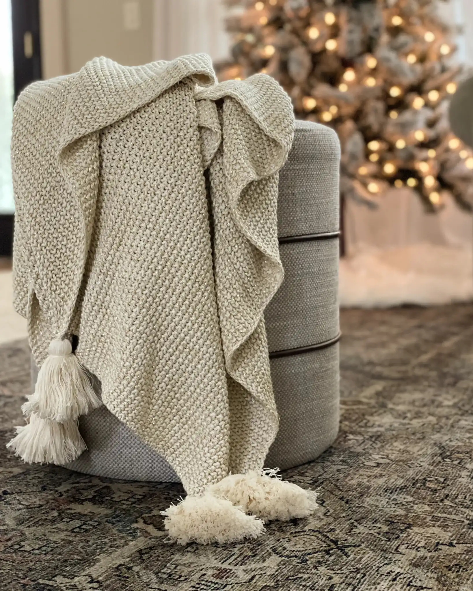 Mari Throw in Beige / Gold in a styled room
