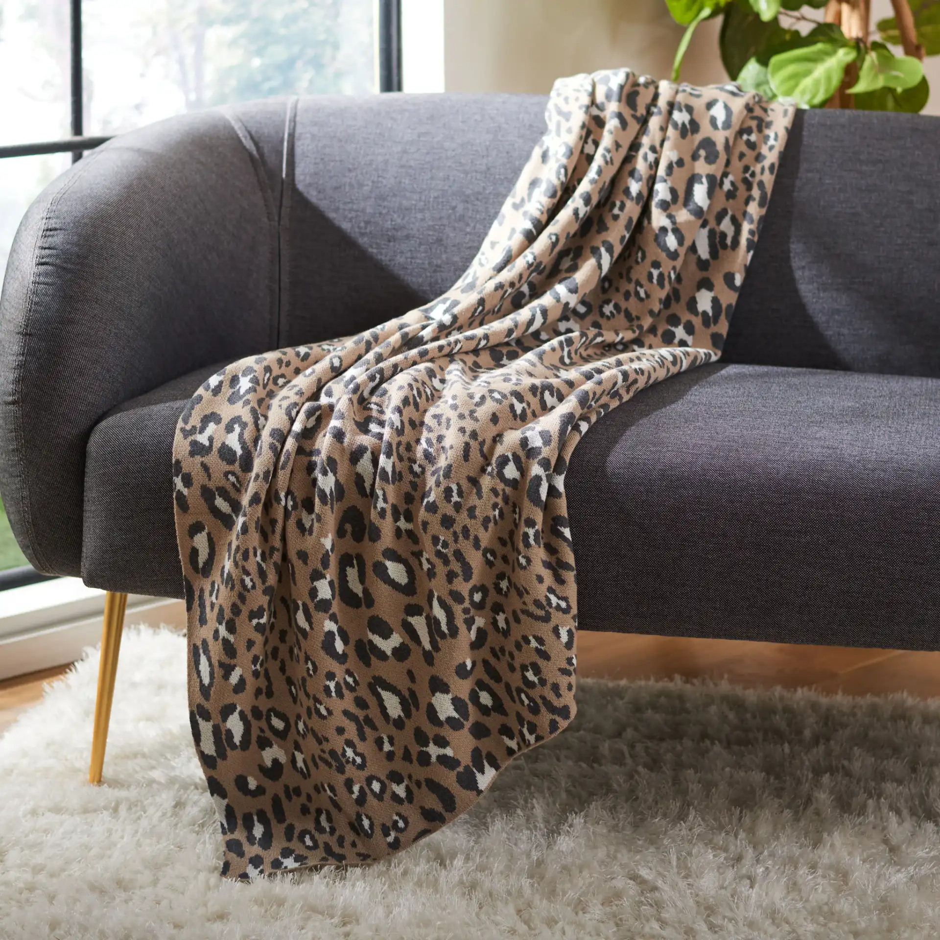 Gwynn Throw in Beige / Black in a styled room