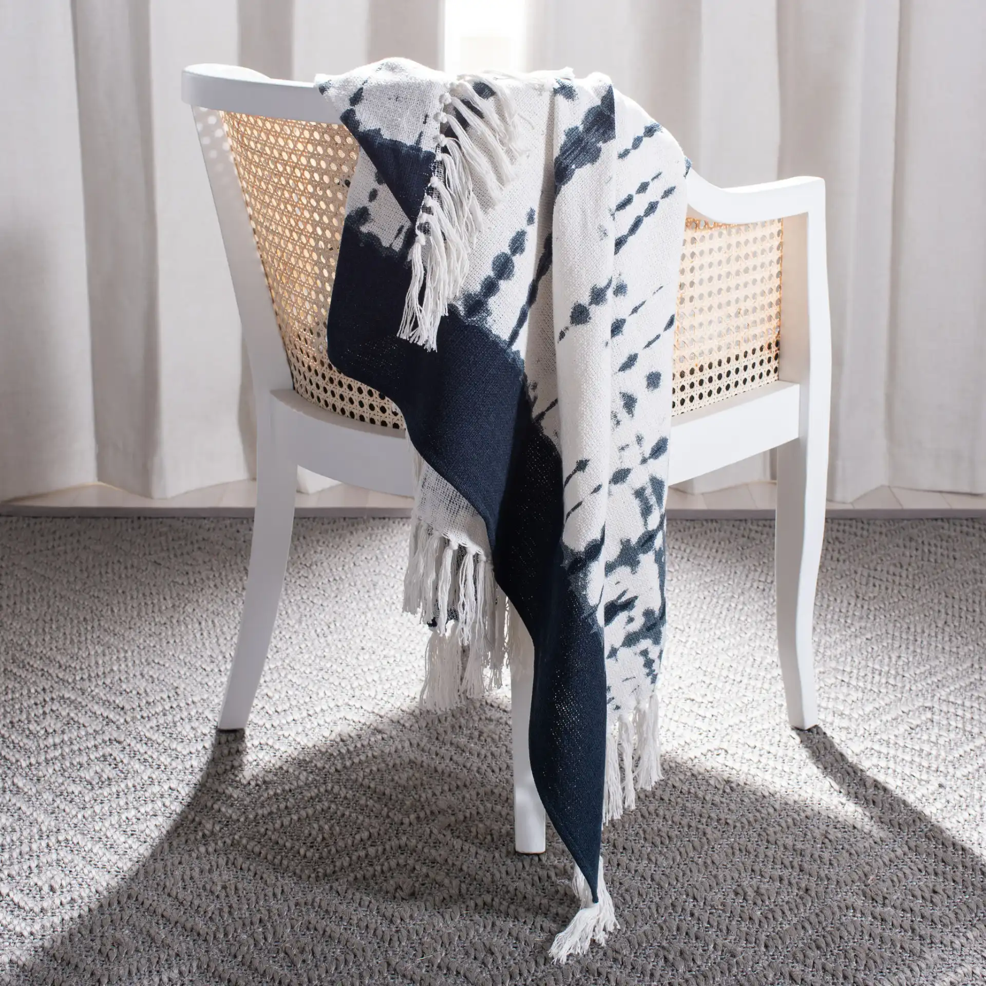 Arya Throw in Beige / Navy in a styled room