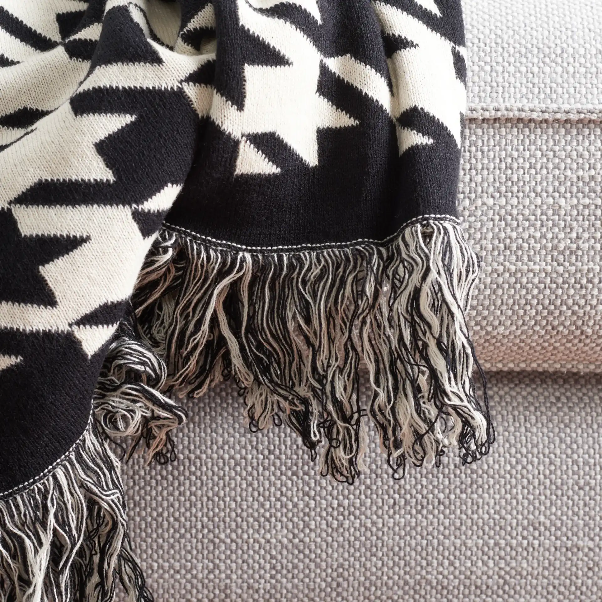 Cantil Throw in Black / Ivory in a styled room