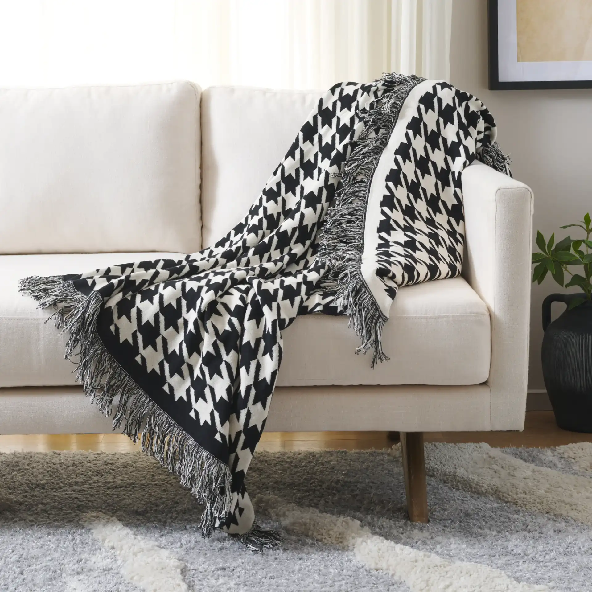 Cantil Throw in Black / Ivory in a styled room