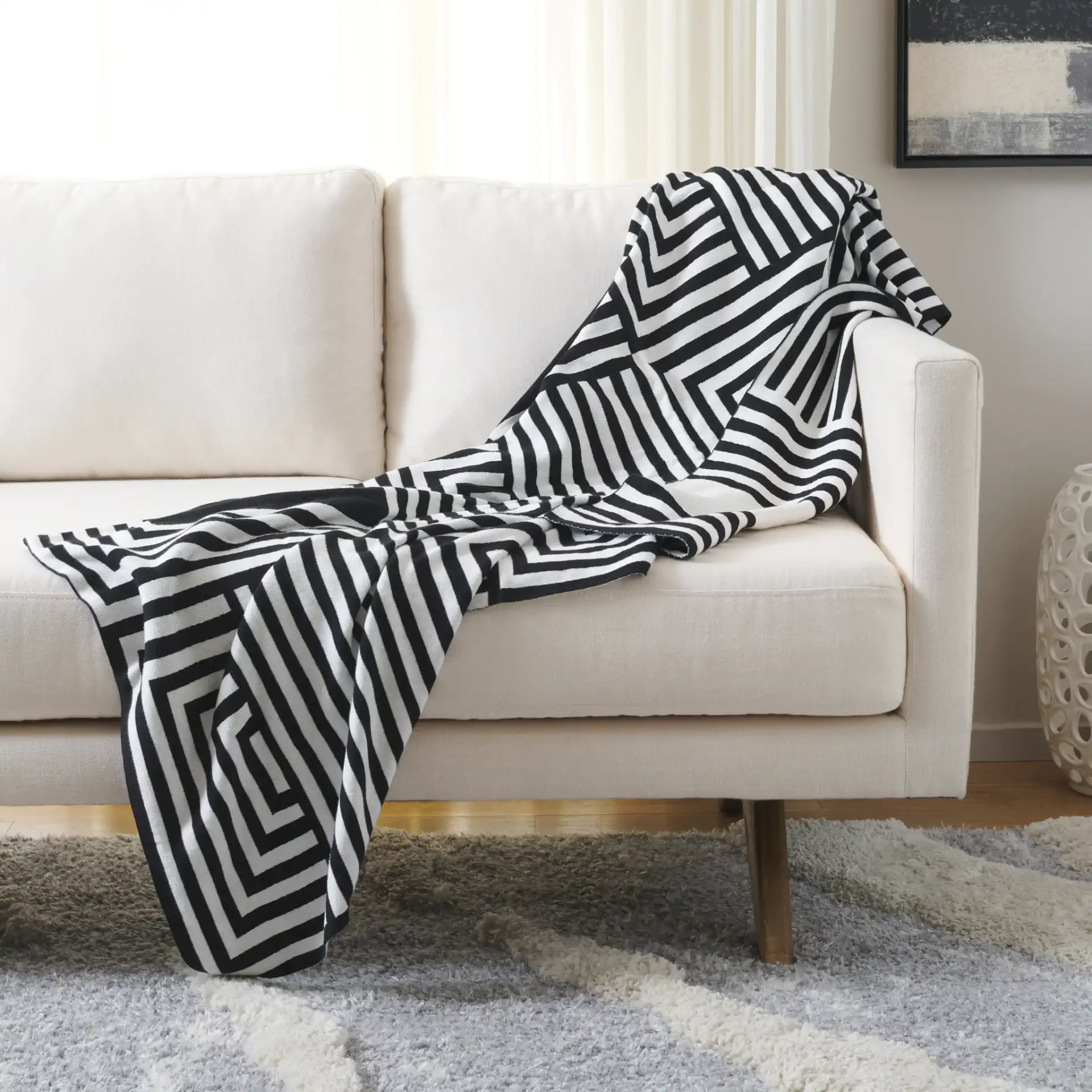 Ziggy Throw in Black / Ivory in a styled room