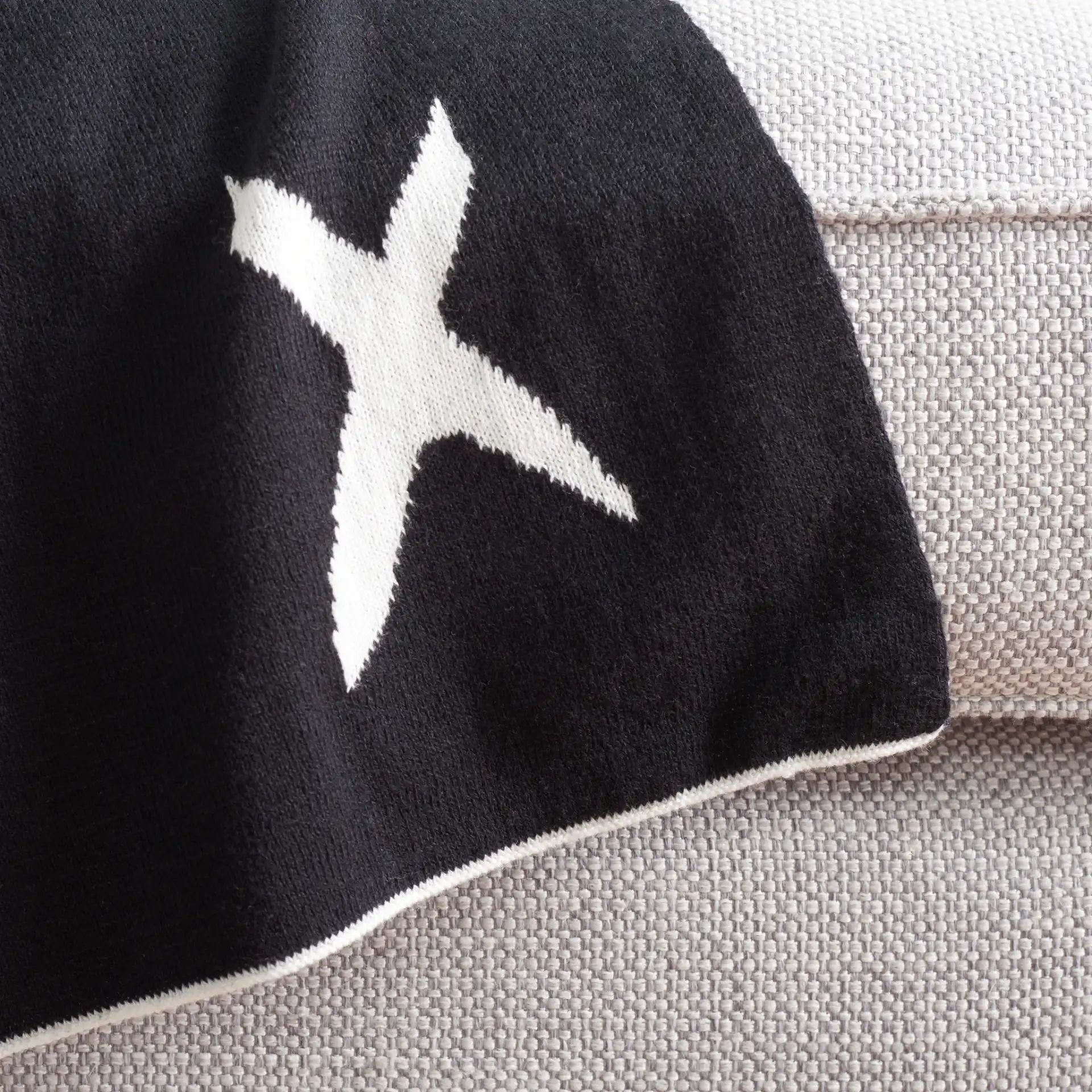 Alto Throw in Black / Ivory in a styled room