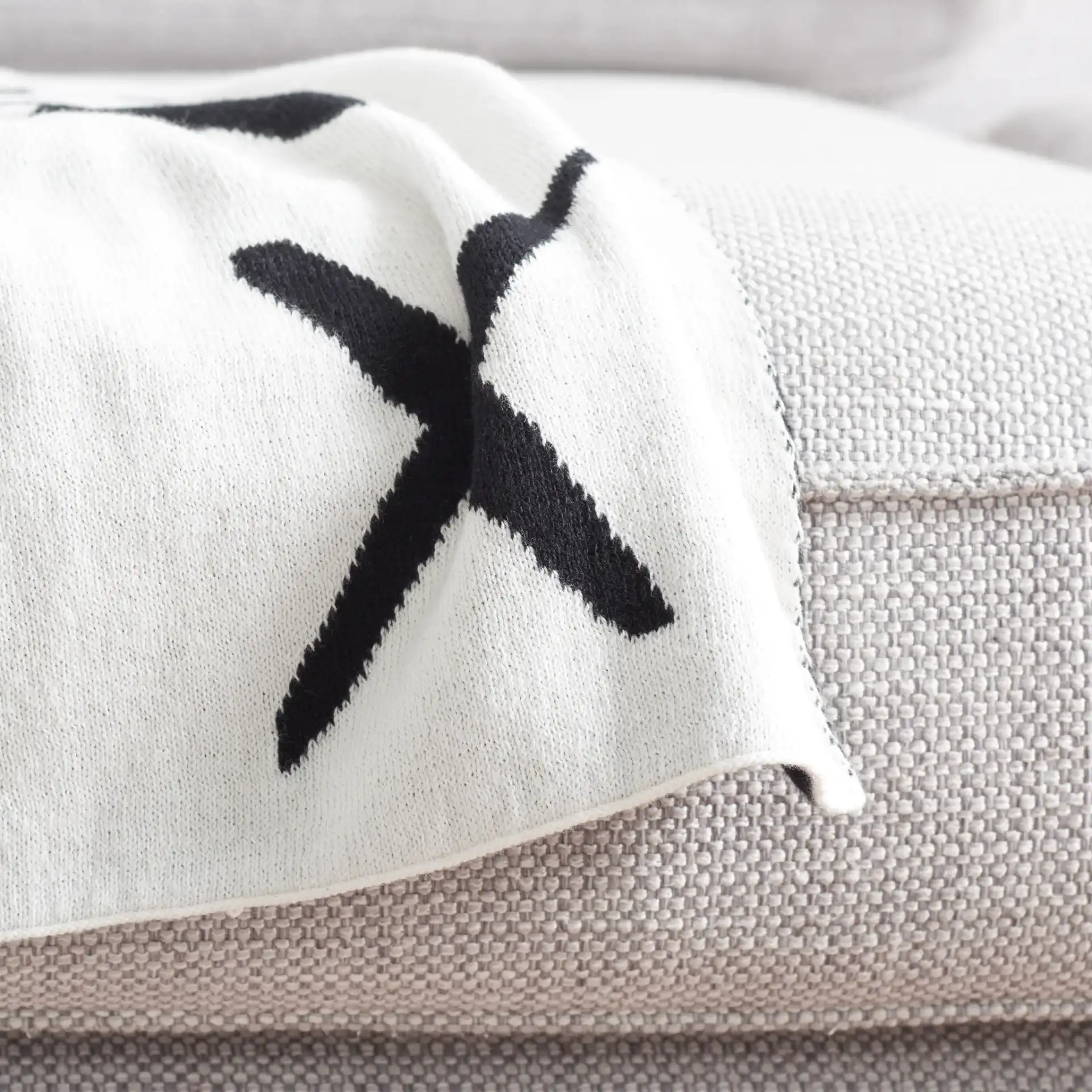 Alto Throw in Black / Ivory in a styled room