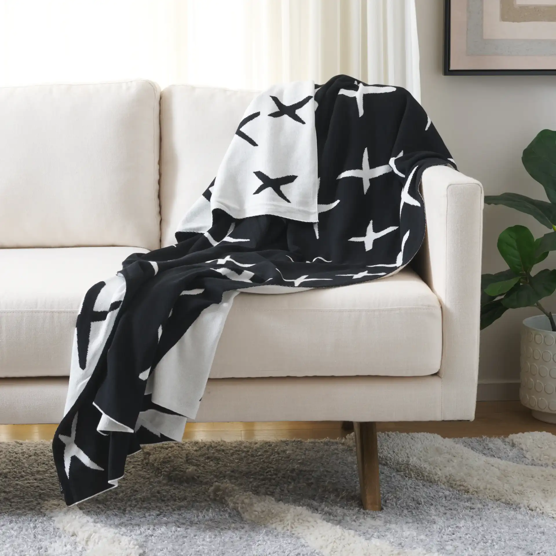 Alto Throw in Black / Ivory in a styled room