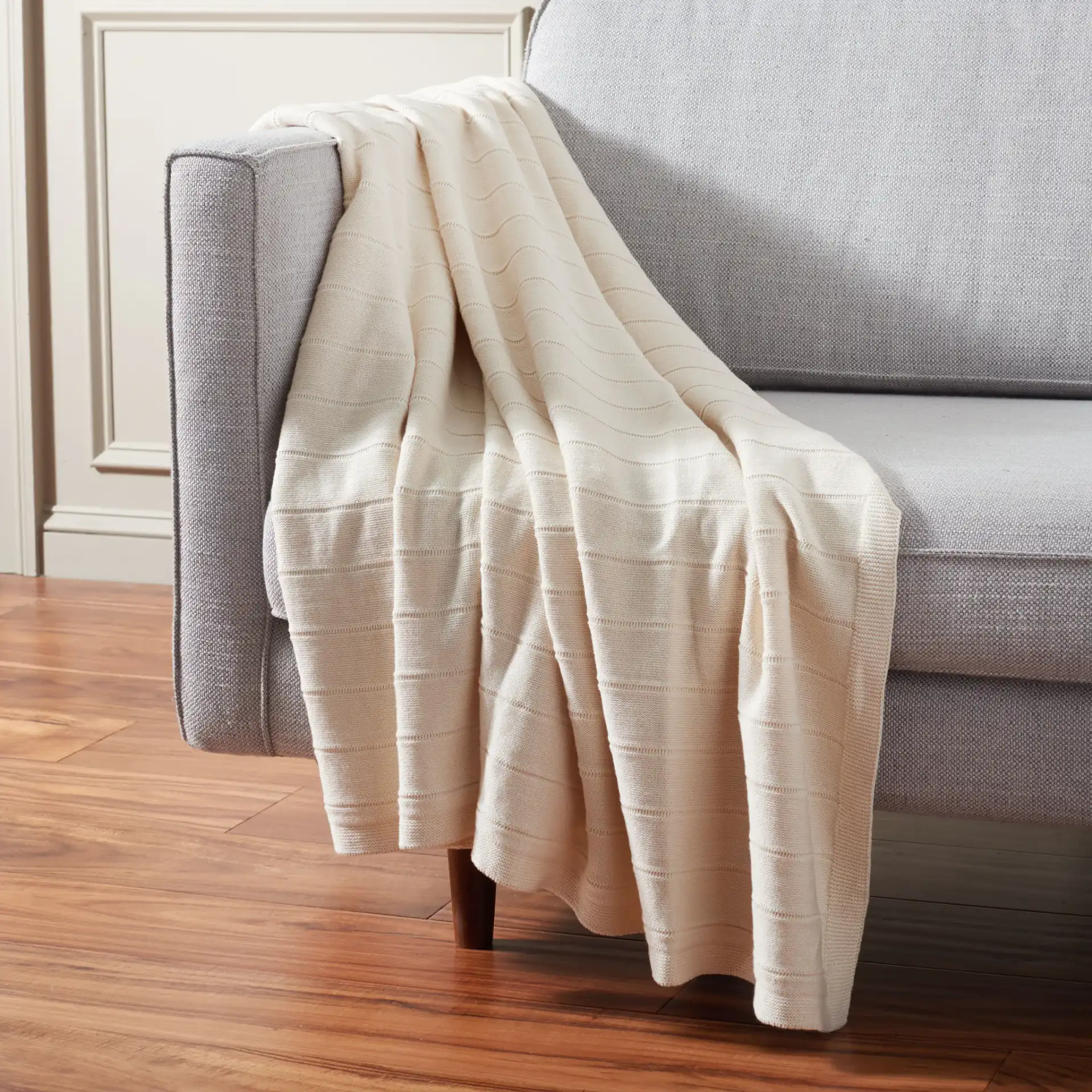Sadra 50X60 Throw in Ivory in a styled room
