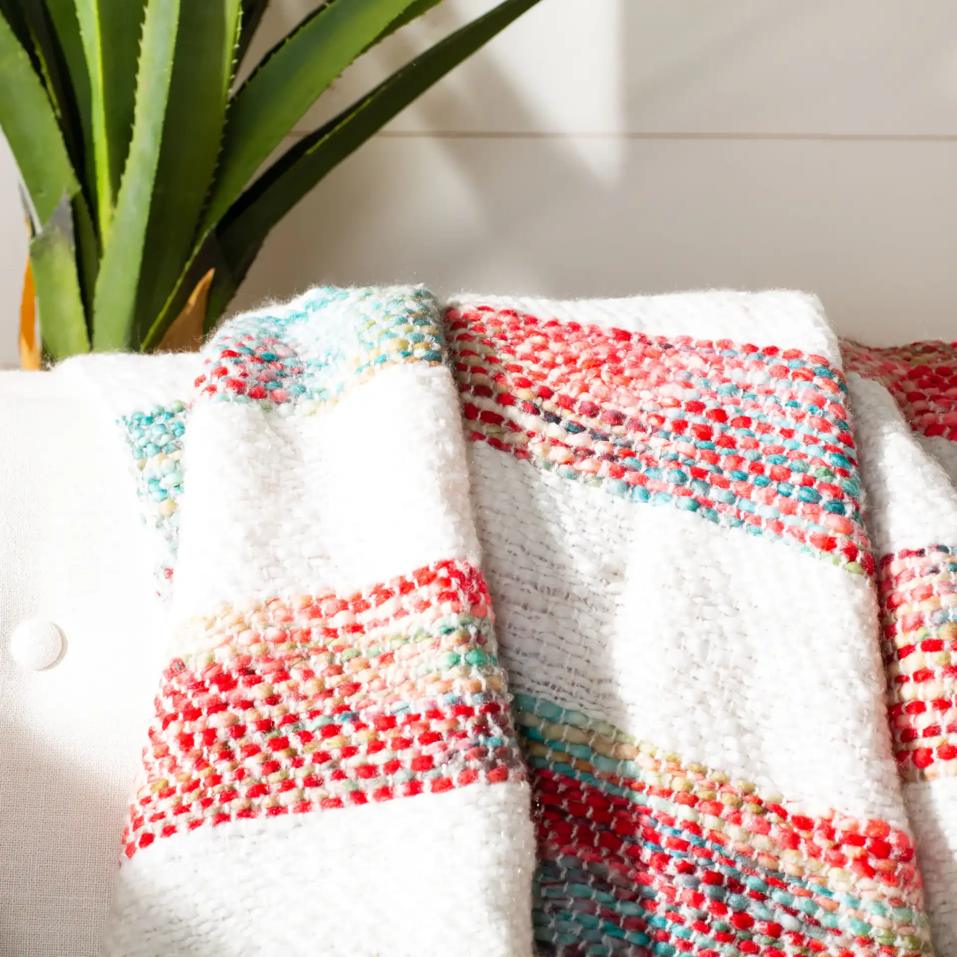 Melsi Throw in Multicolor in a styled room