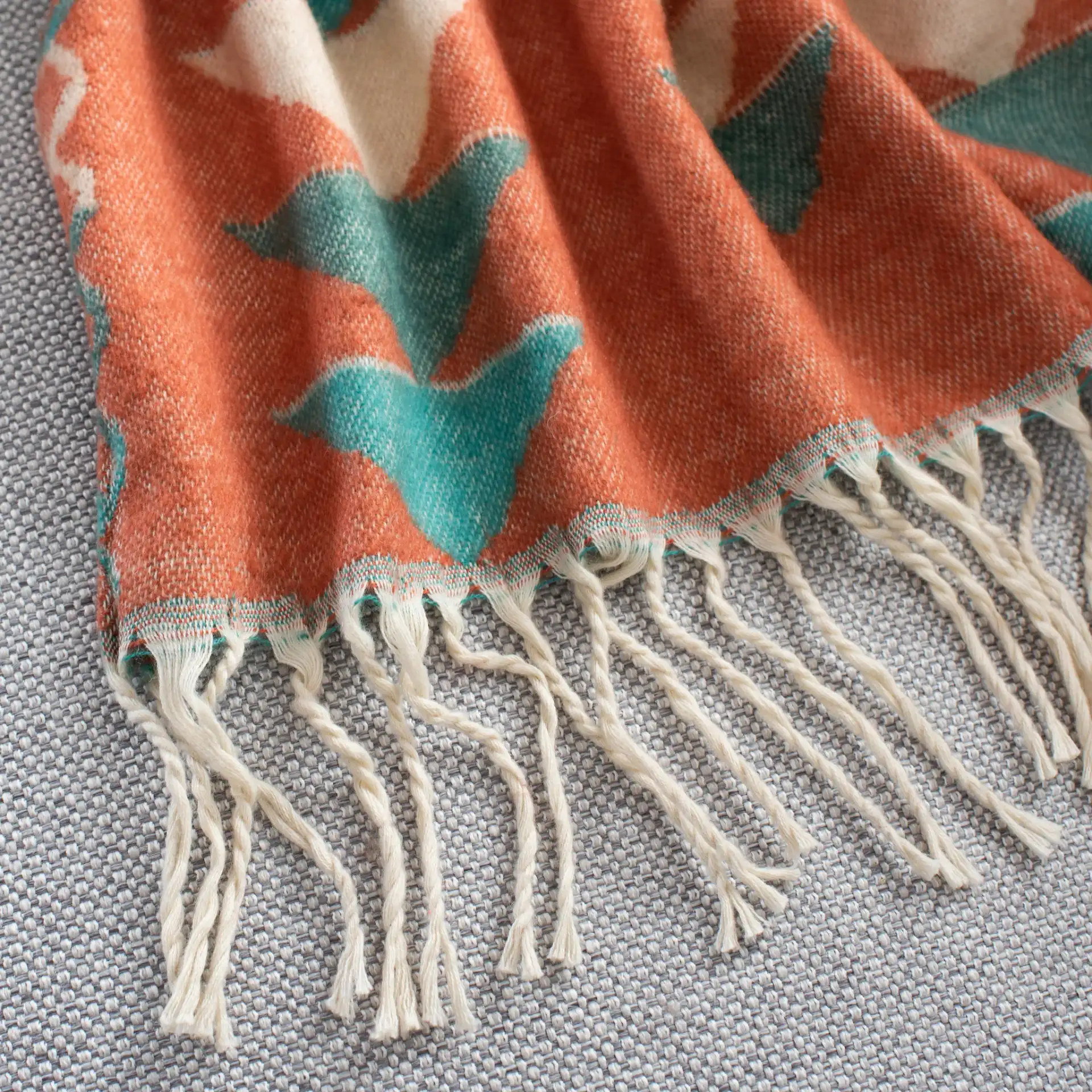 Myna Throw in Multicolor in a styled room