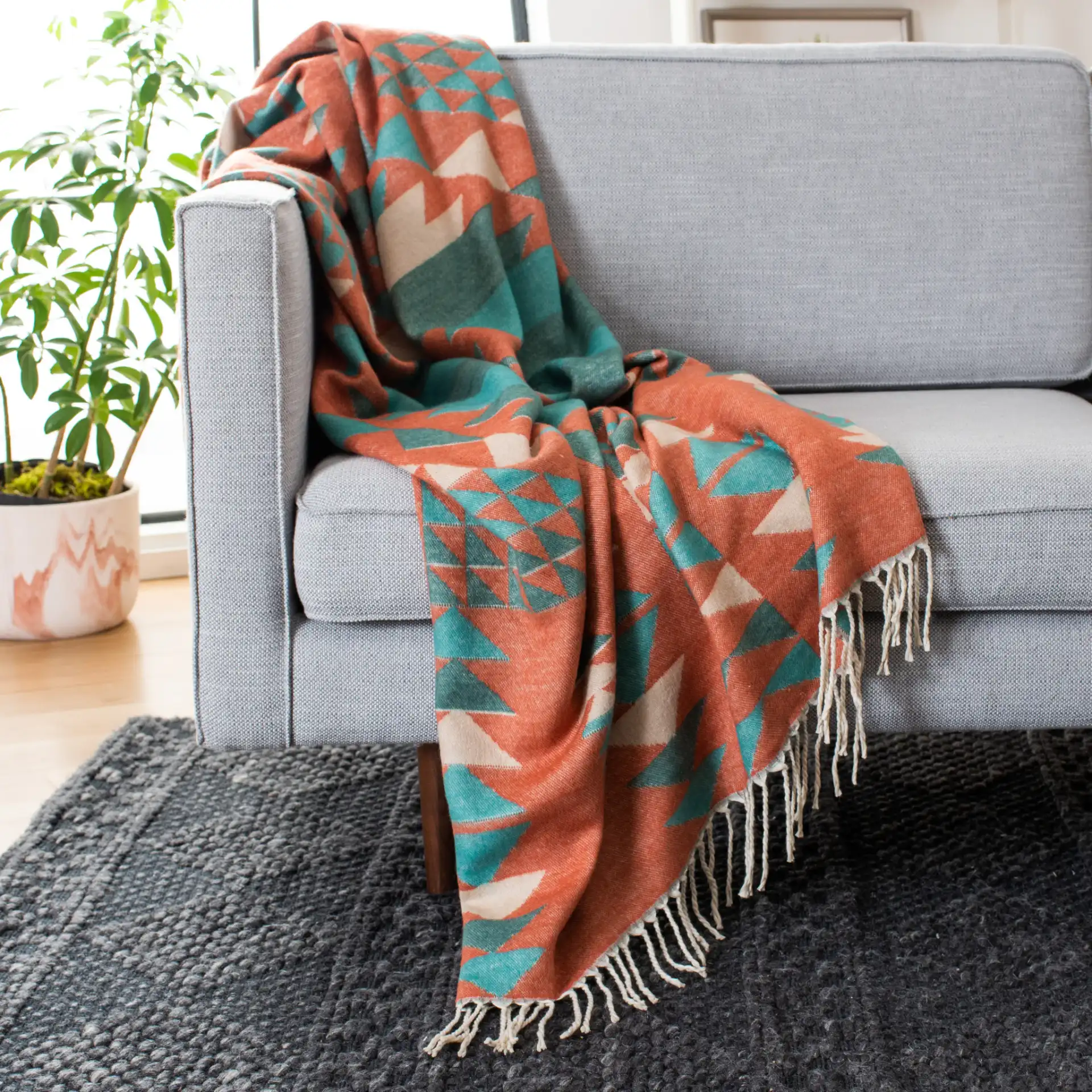 Myna Throw in Multicolor in a styled room