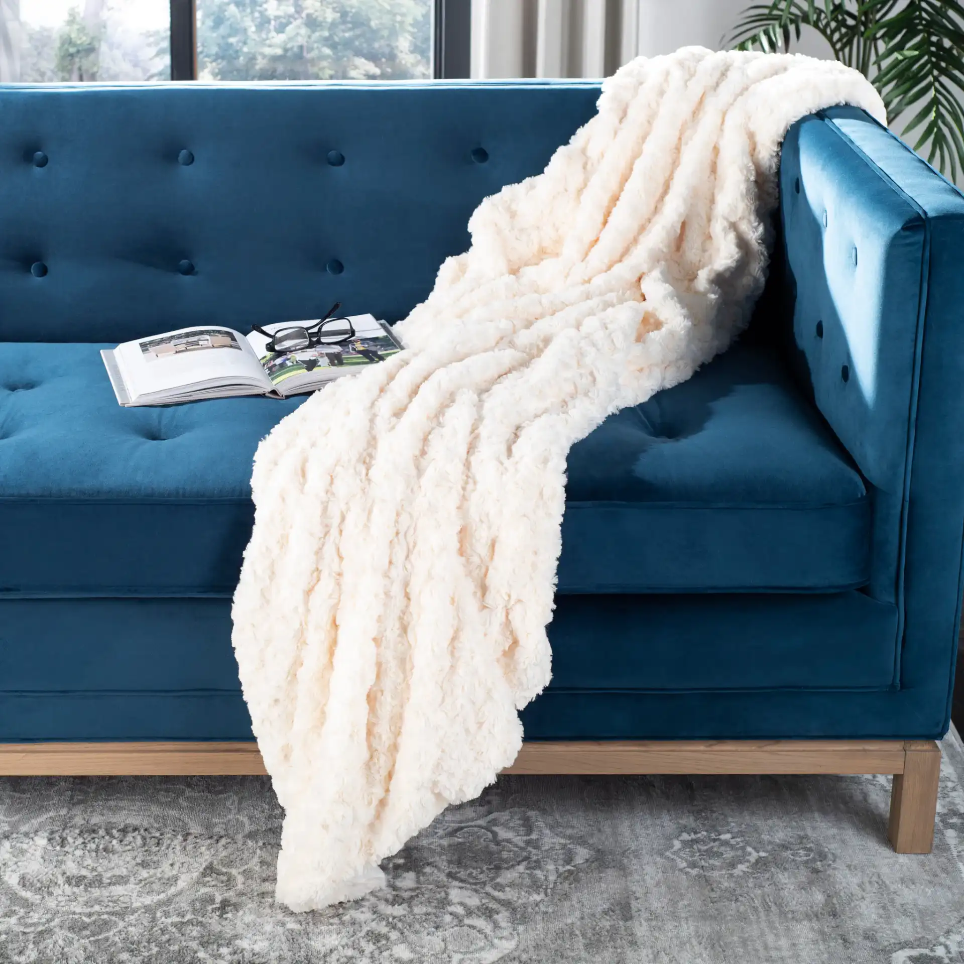 Pebbles Throw in Cream in a styled room