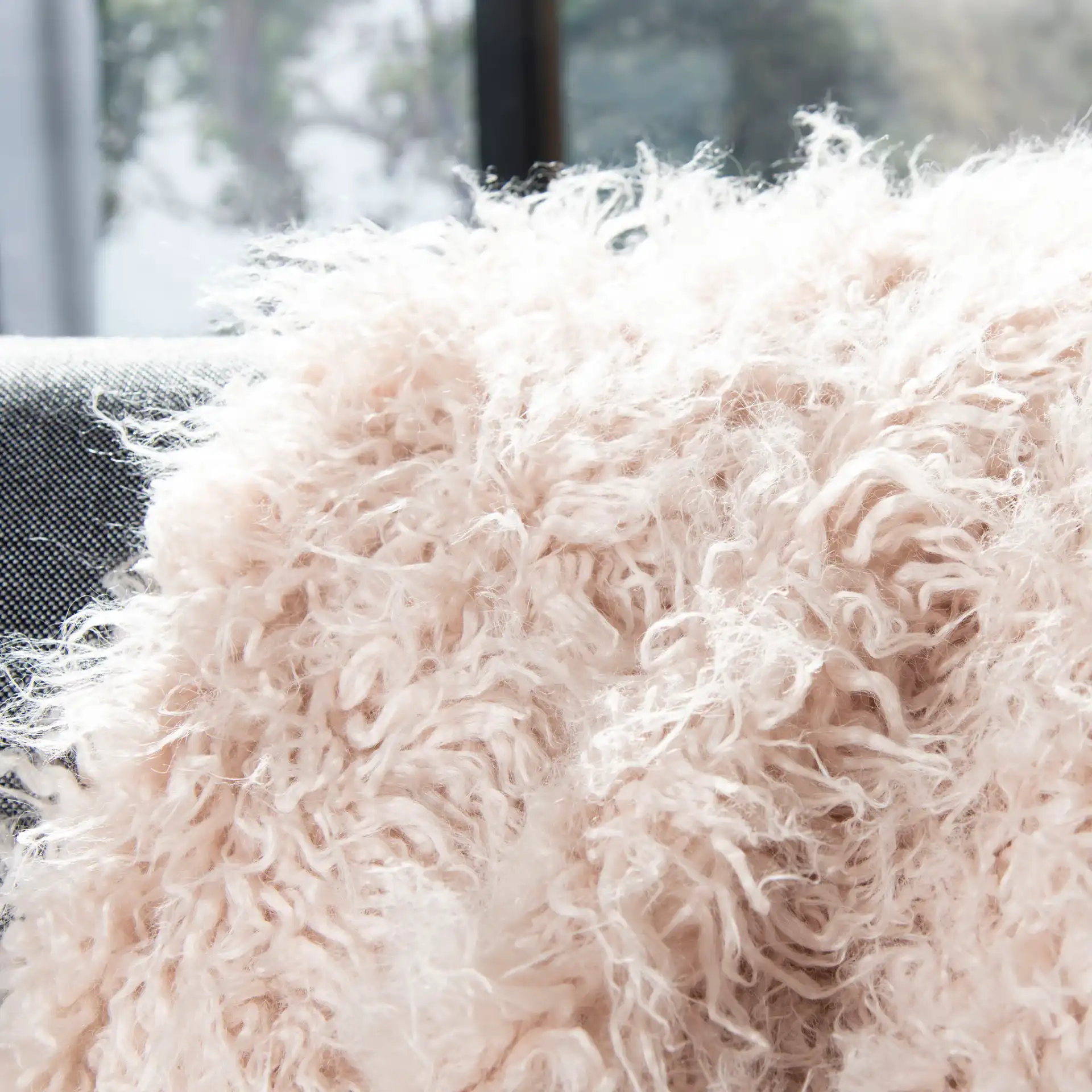 Faux Sheepskin Throw in Taupe in a styled room