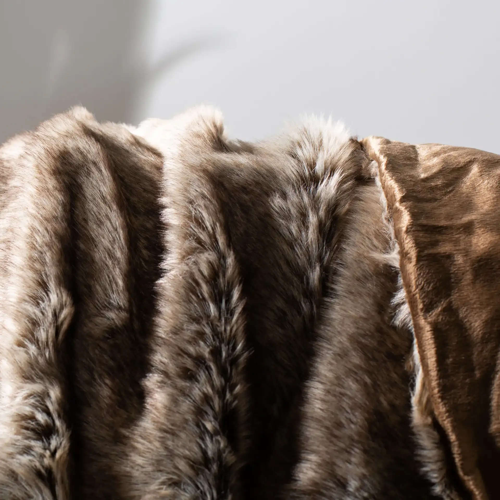 Luxe Sheen Throw in Antique Blue in a styled room