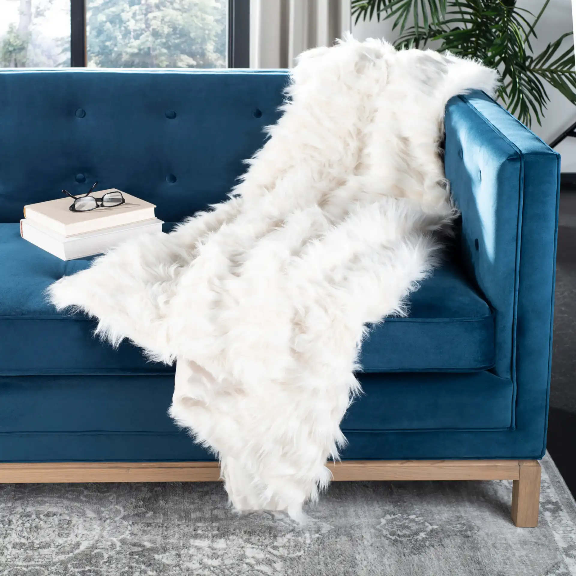 Luxe Feather Throw in White in a styled room