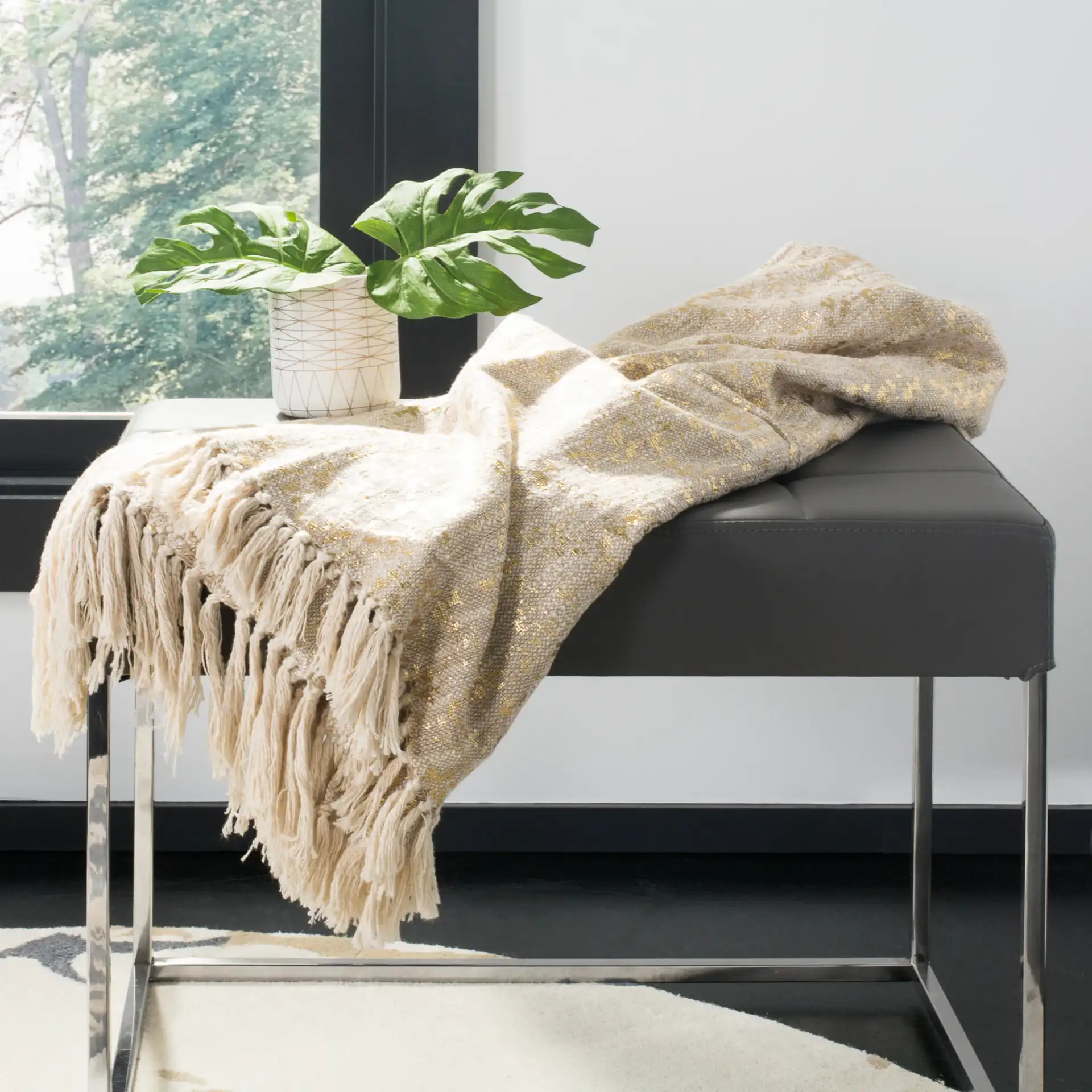Peppin Metallic Throw in Natural / Gold in a styled room