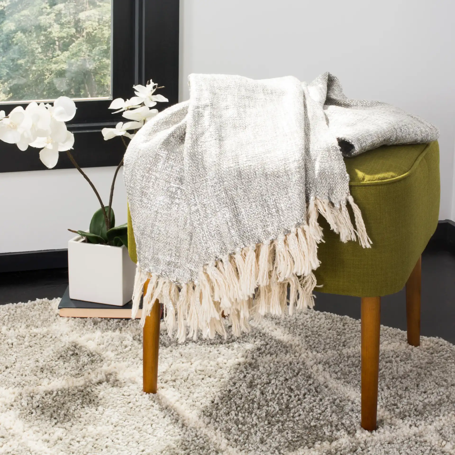 Jacqui Metallic Throw in Gray / Silver in a styled room