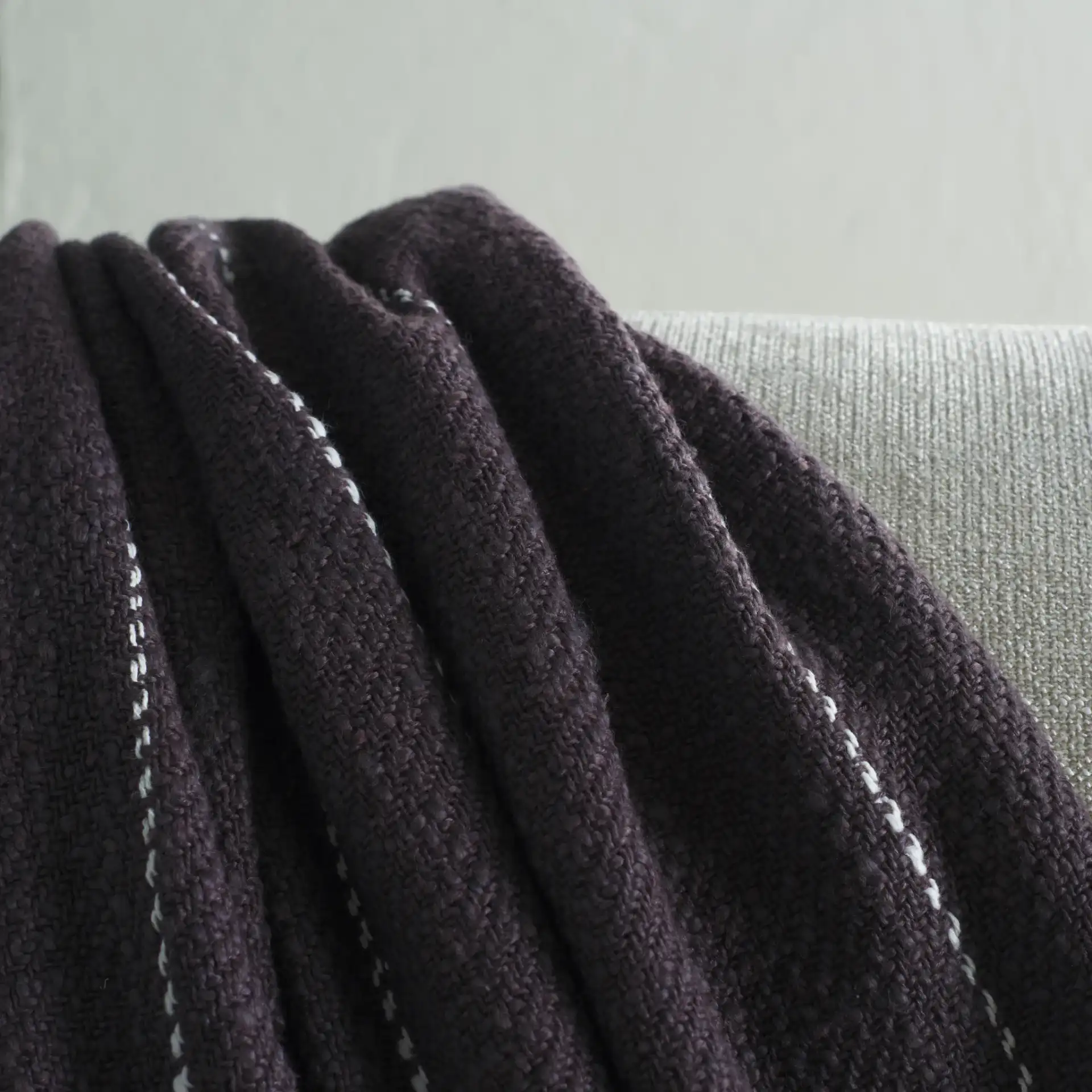Sloane Cotton Throw in Gray / White in a styled room