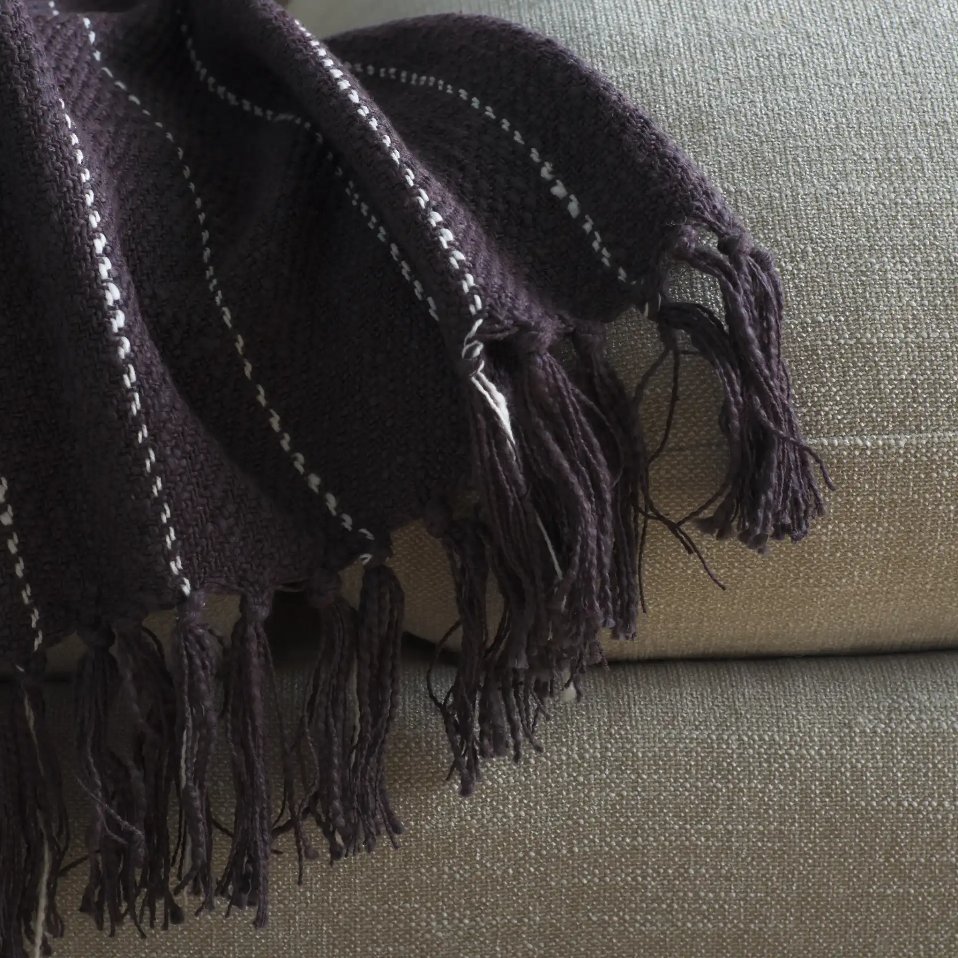 Sloane Cotton Throw in Gray / White in a styled room