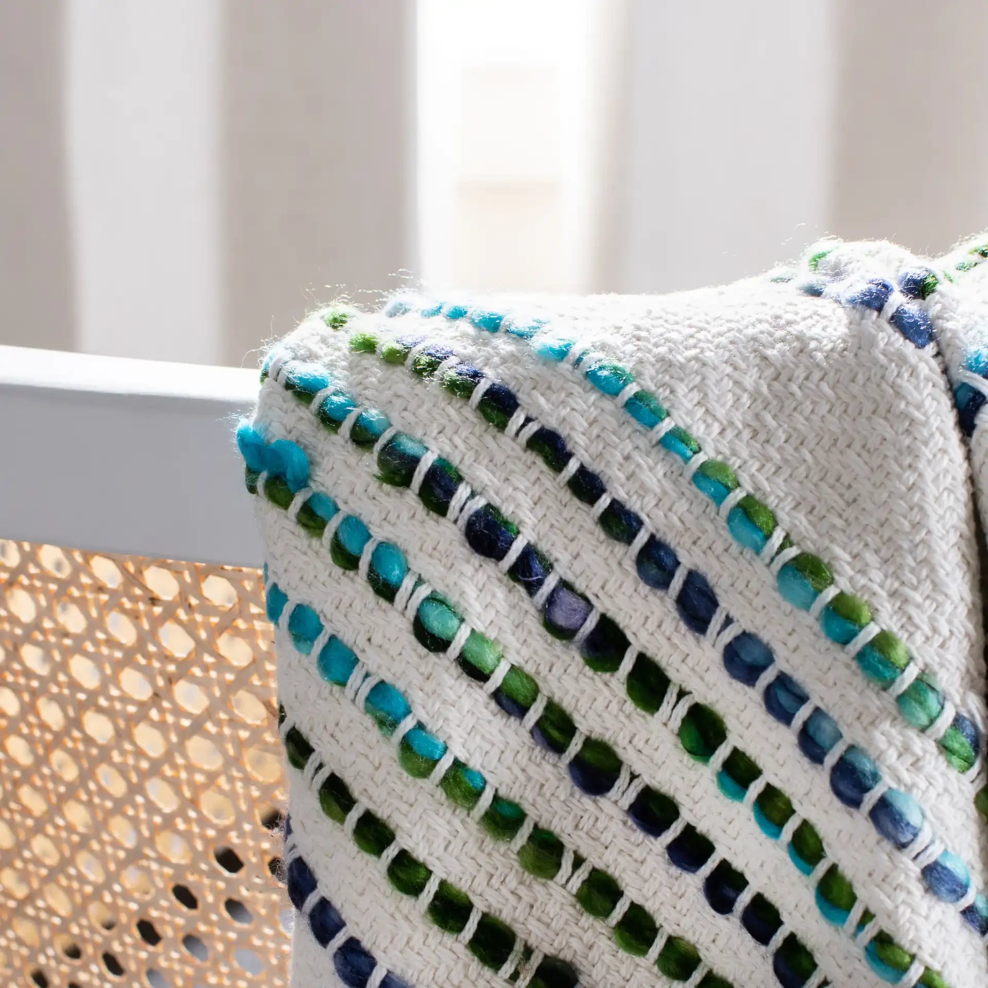 Landra Throw in Cream in a styled room