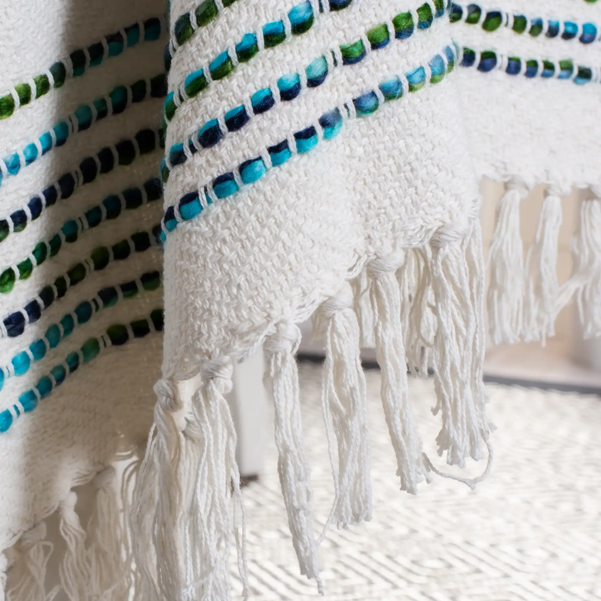 Landra Throw in Cream in a styled room
