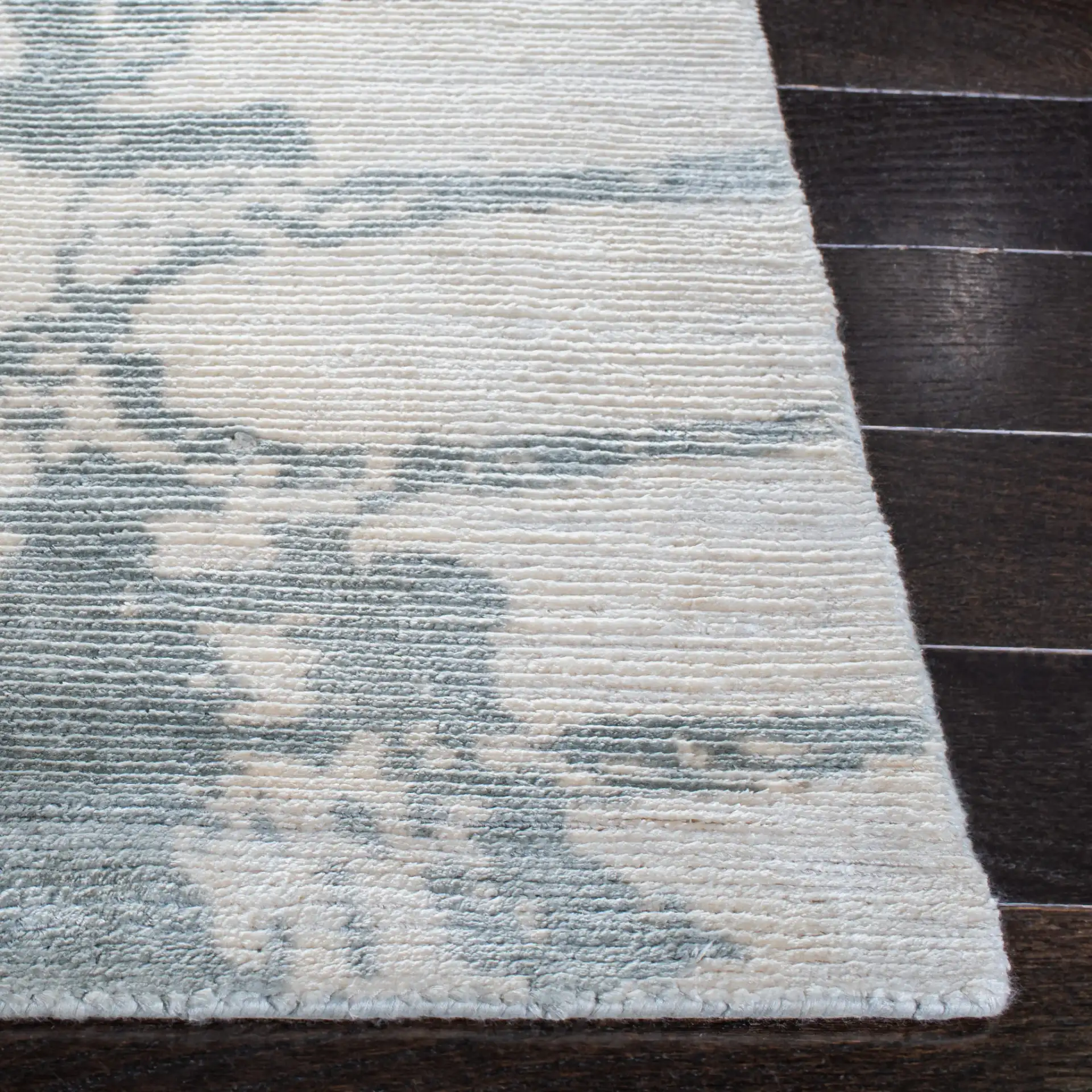 Tibetan Distressed Abstract Hand-Loomed Viscose Rug in Light Gray in a styled room