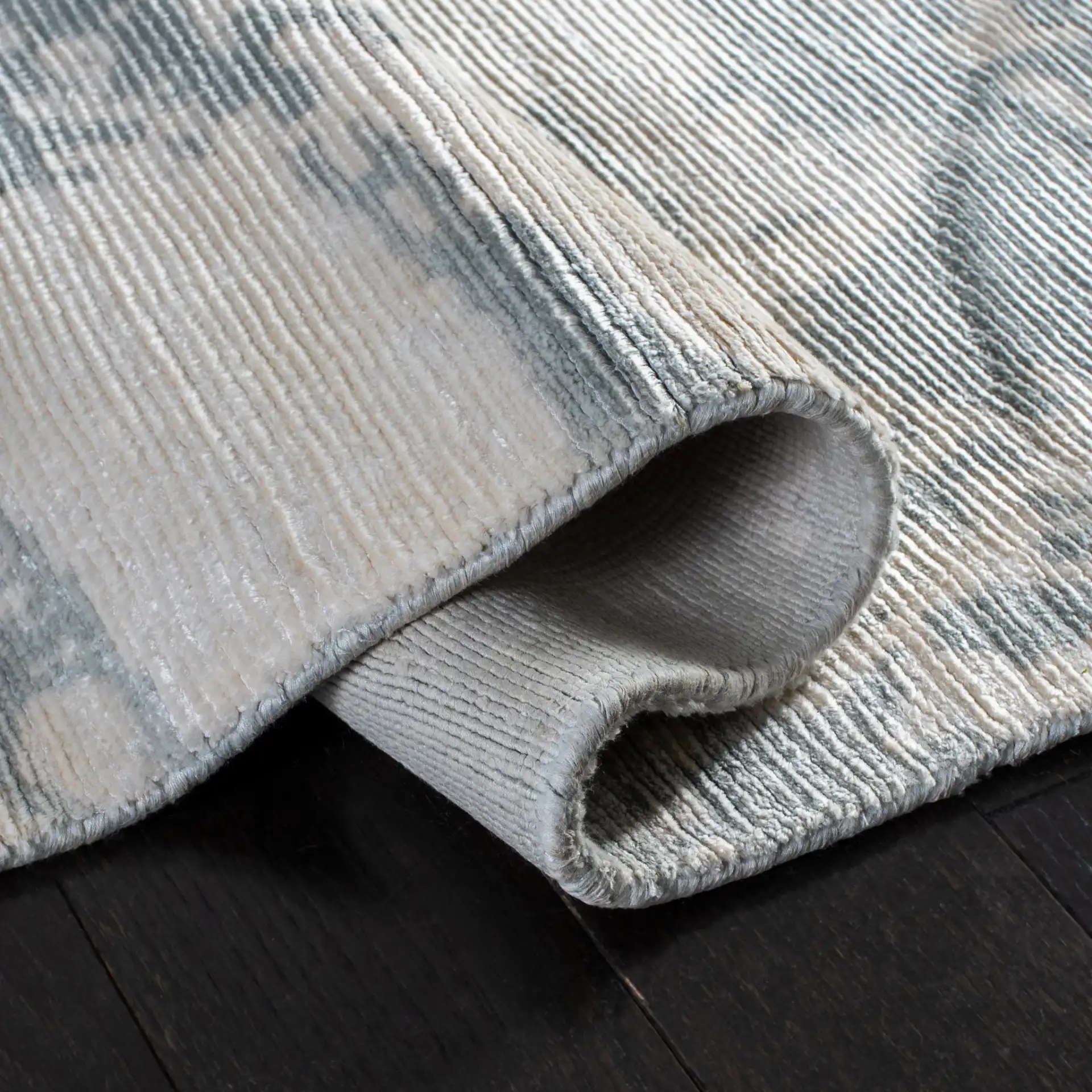 Tibetan Distressed Abstract Hand-Loomed Viscose Rug in Light Gray in a styled room