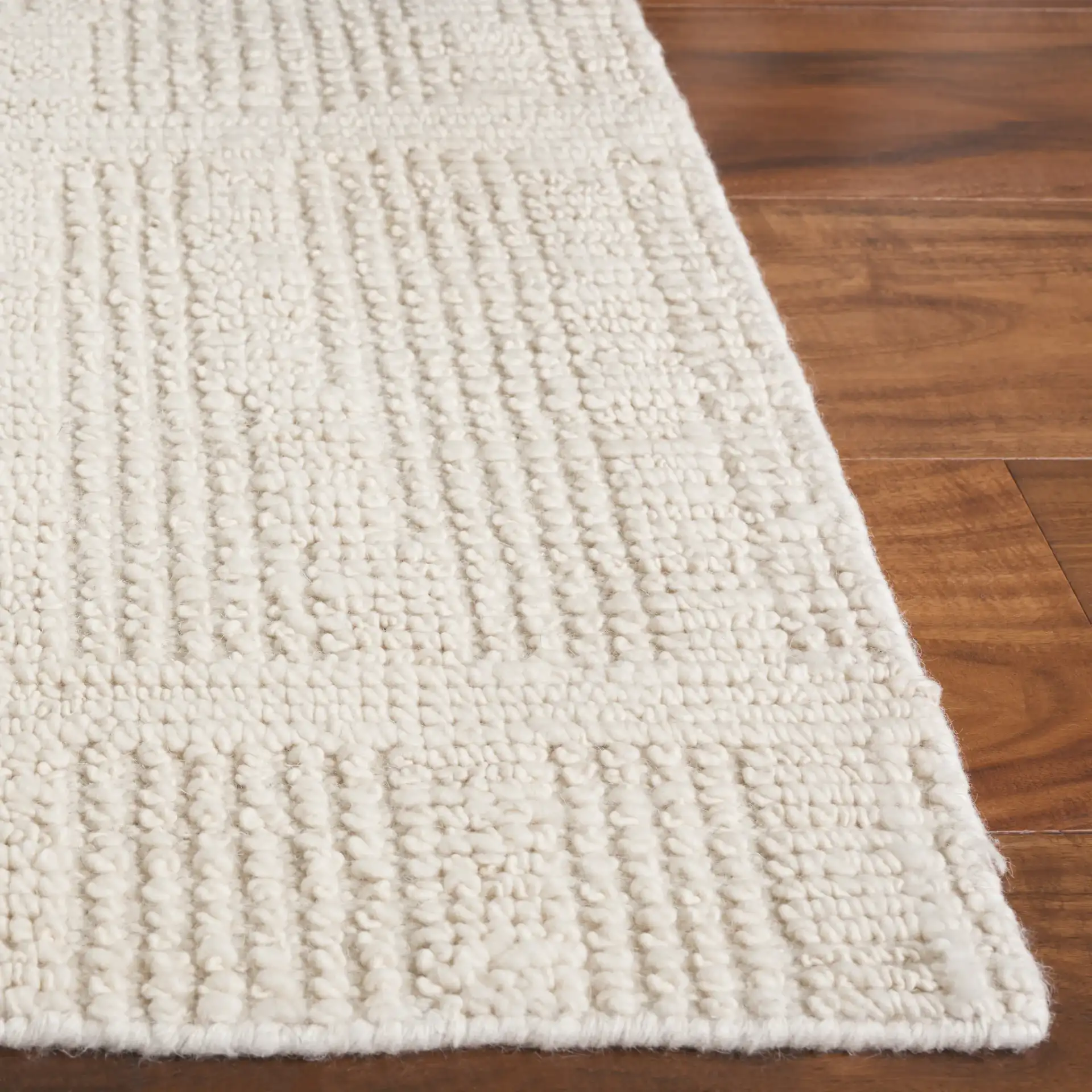 Tibetan Textured Grid Hand-Knotted Wool Rug in Ivory in a styled room