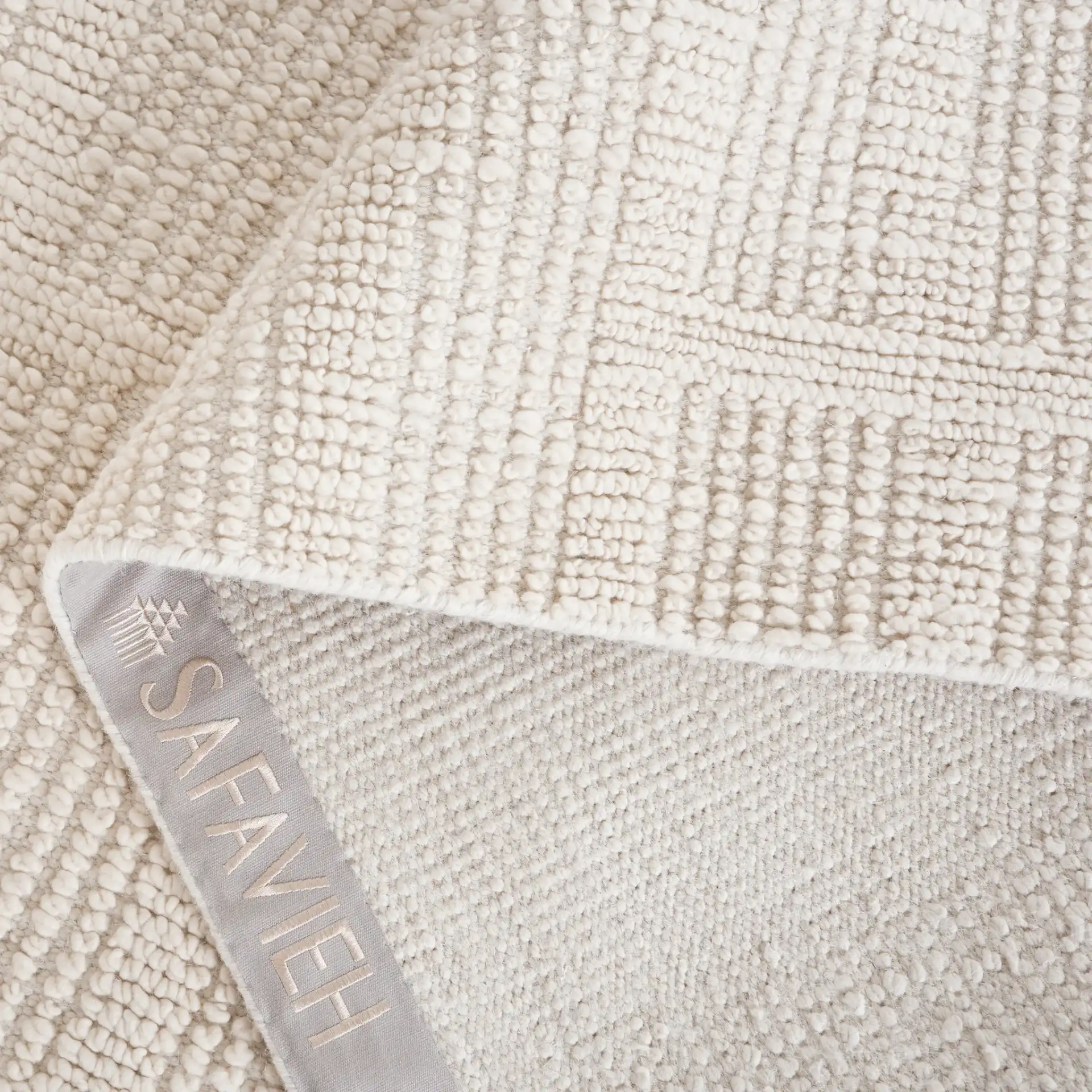 Tibetan Textured Grid Hand-Knotted Wool Rug in Ivory in a styled room