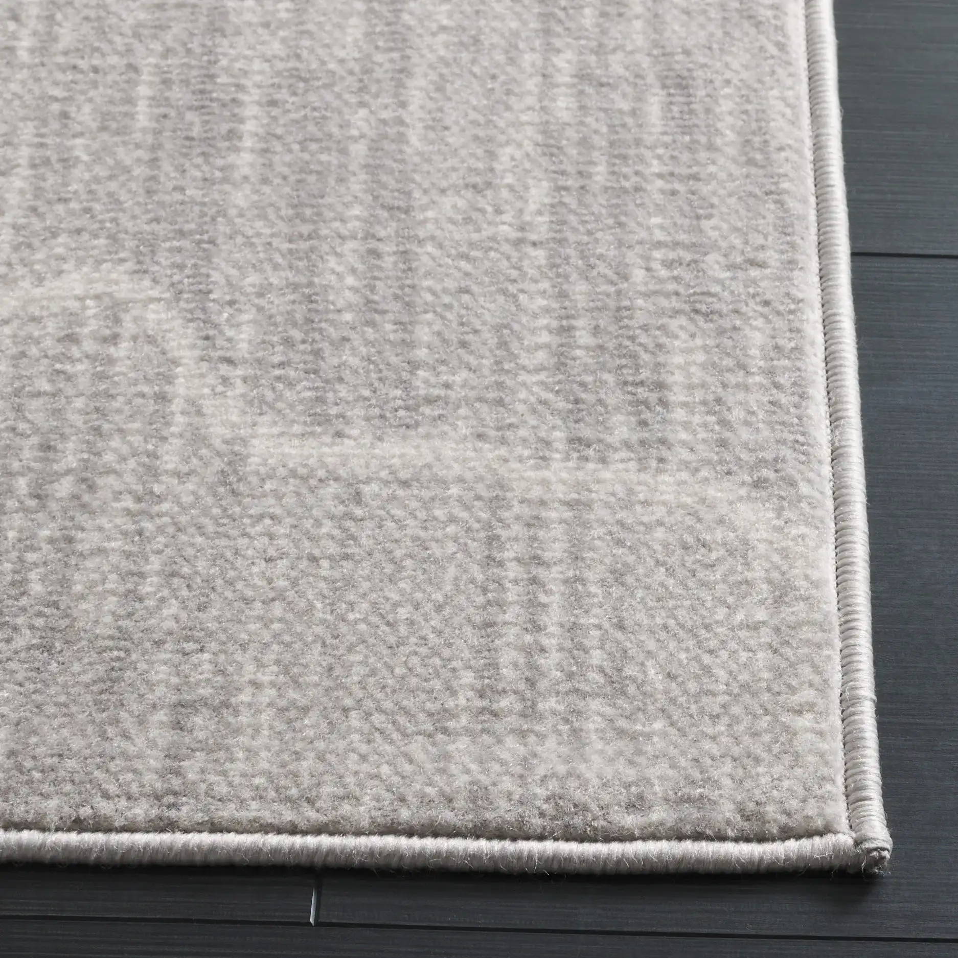 Temple Wave Rug in Gray / Dark Gray in a styled room