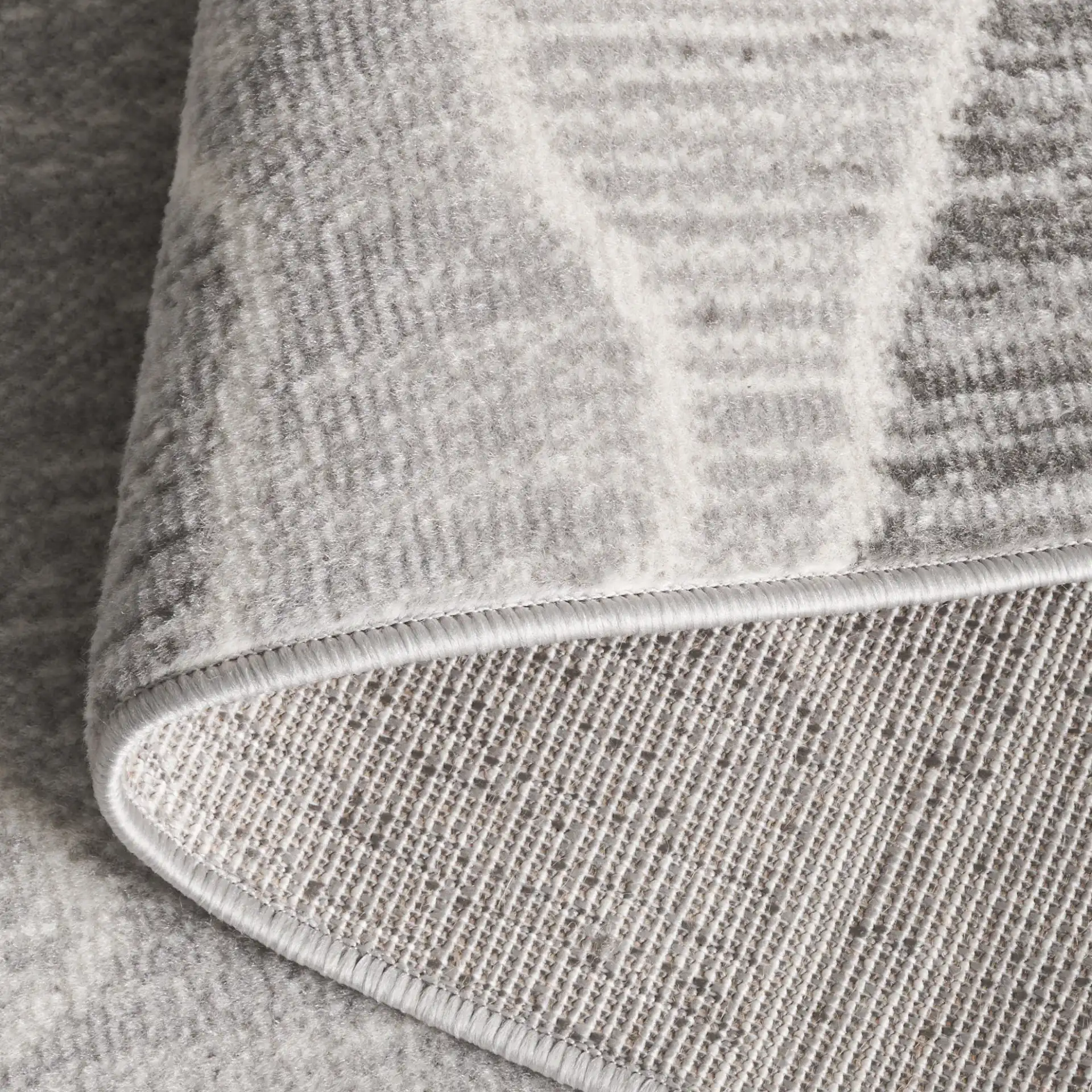 Temple Wave Rug in Gray / Dark Gray in a styled room