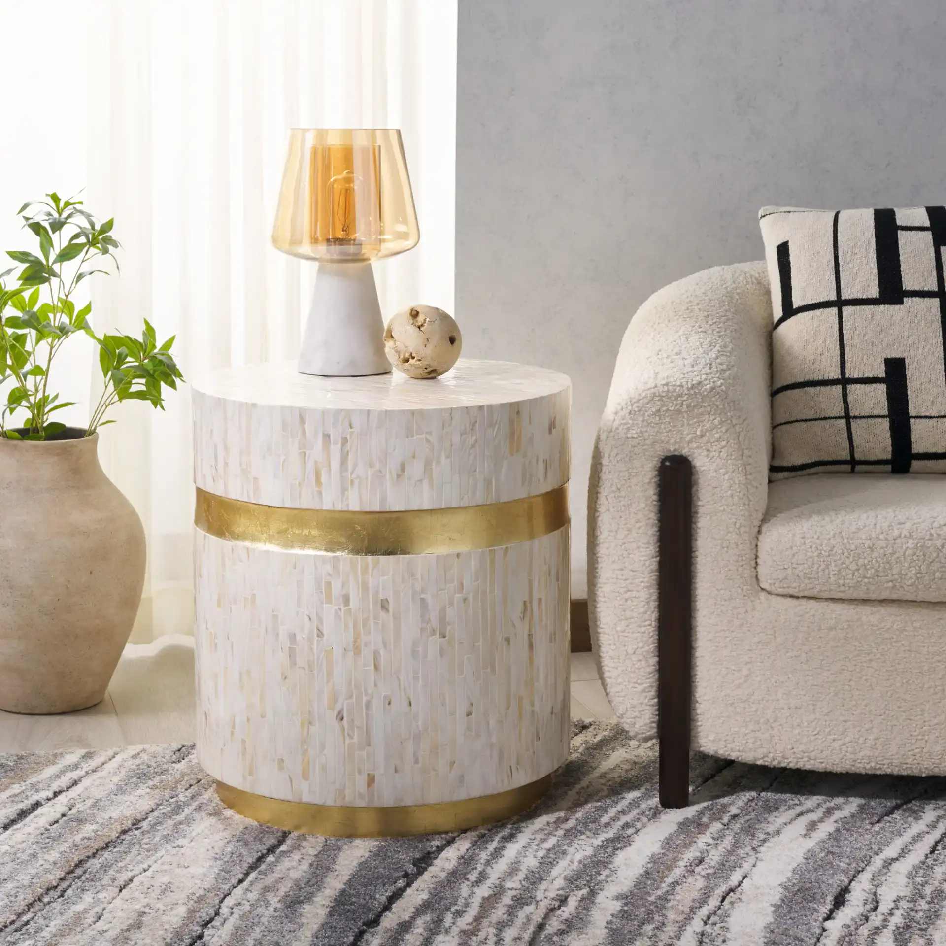 Perla Mosaic Round Side Table in Pink Champagne / Gold in a styled room