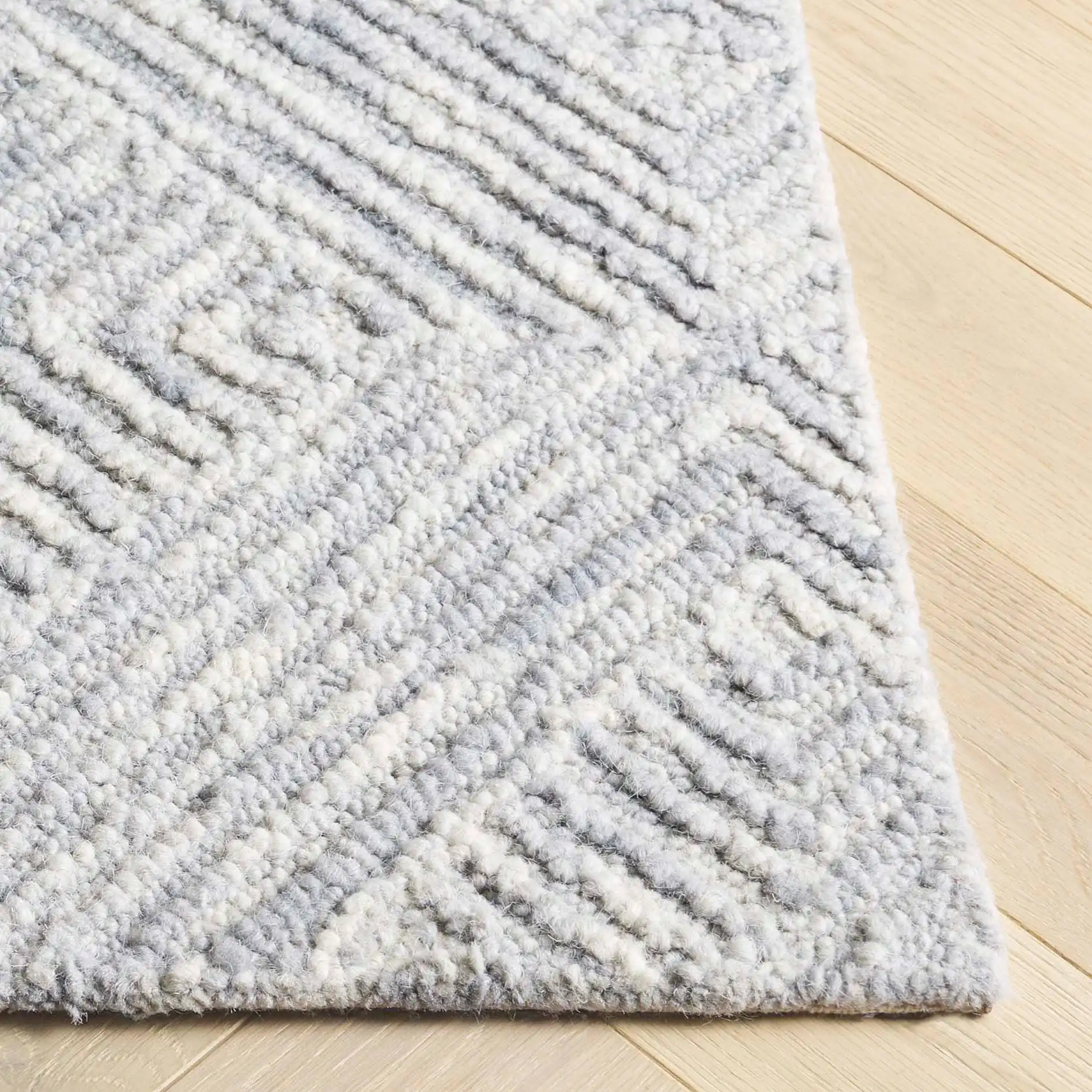 Trace Concentric Diamond Hand-Tufted Wool Rug in Gray in a styled room