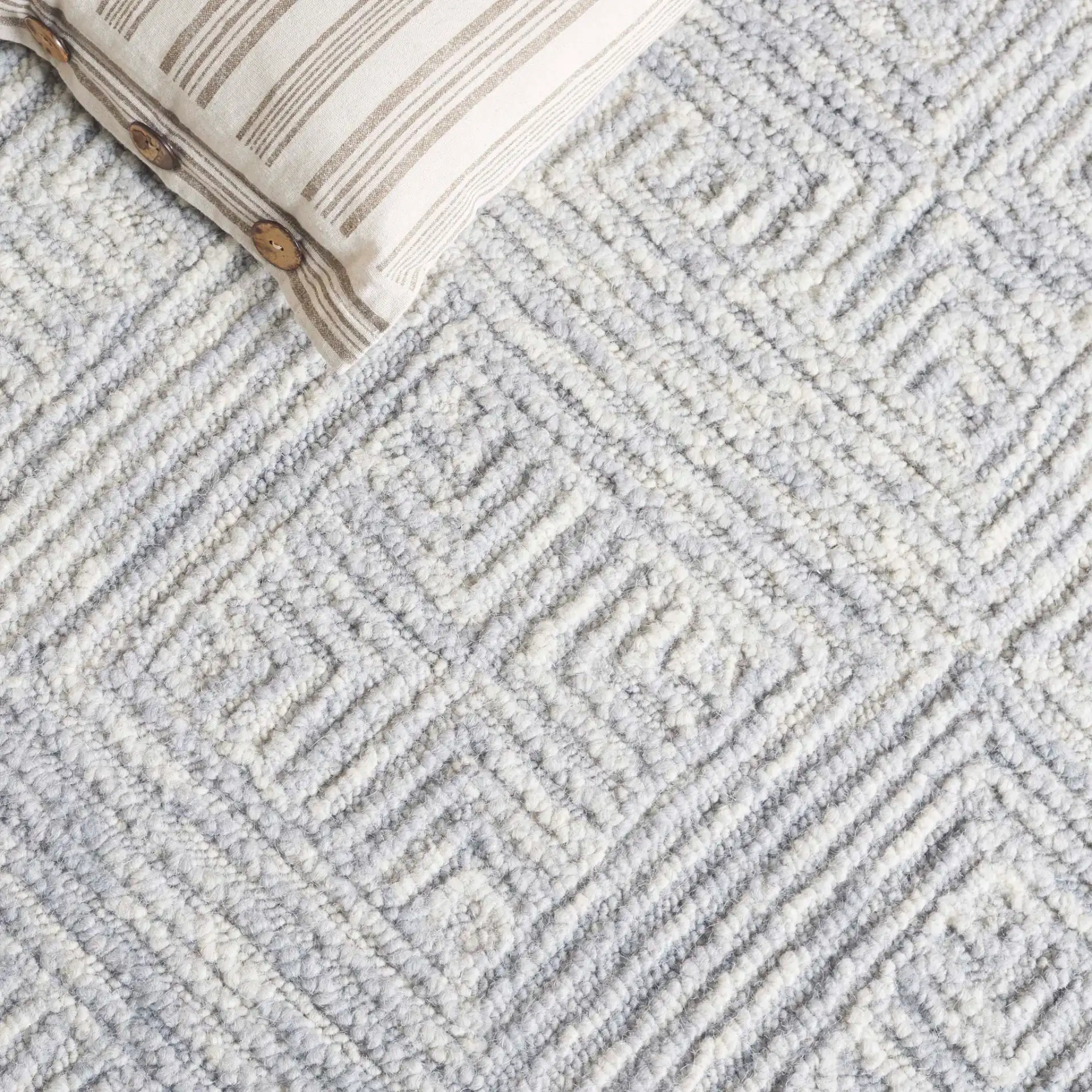Trace Concentric Diamond Hand-Tufted Wool Rug in Gray in a styled room