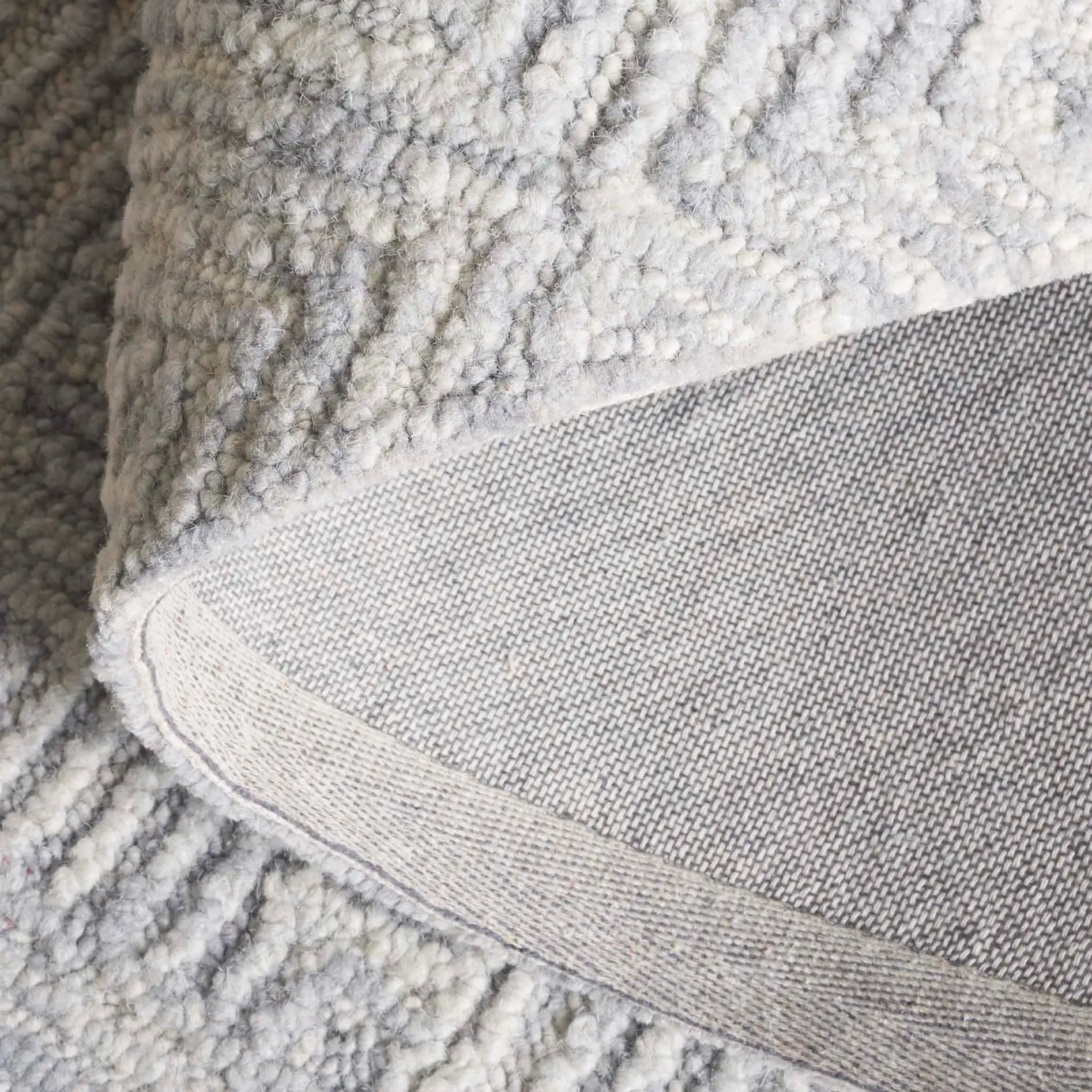 Trace Concentric Diamond Hand-Tufted Wool Rug in Gray in a styled room