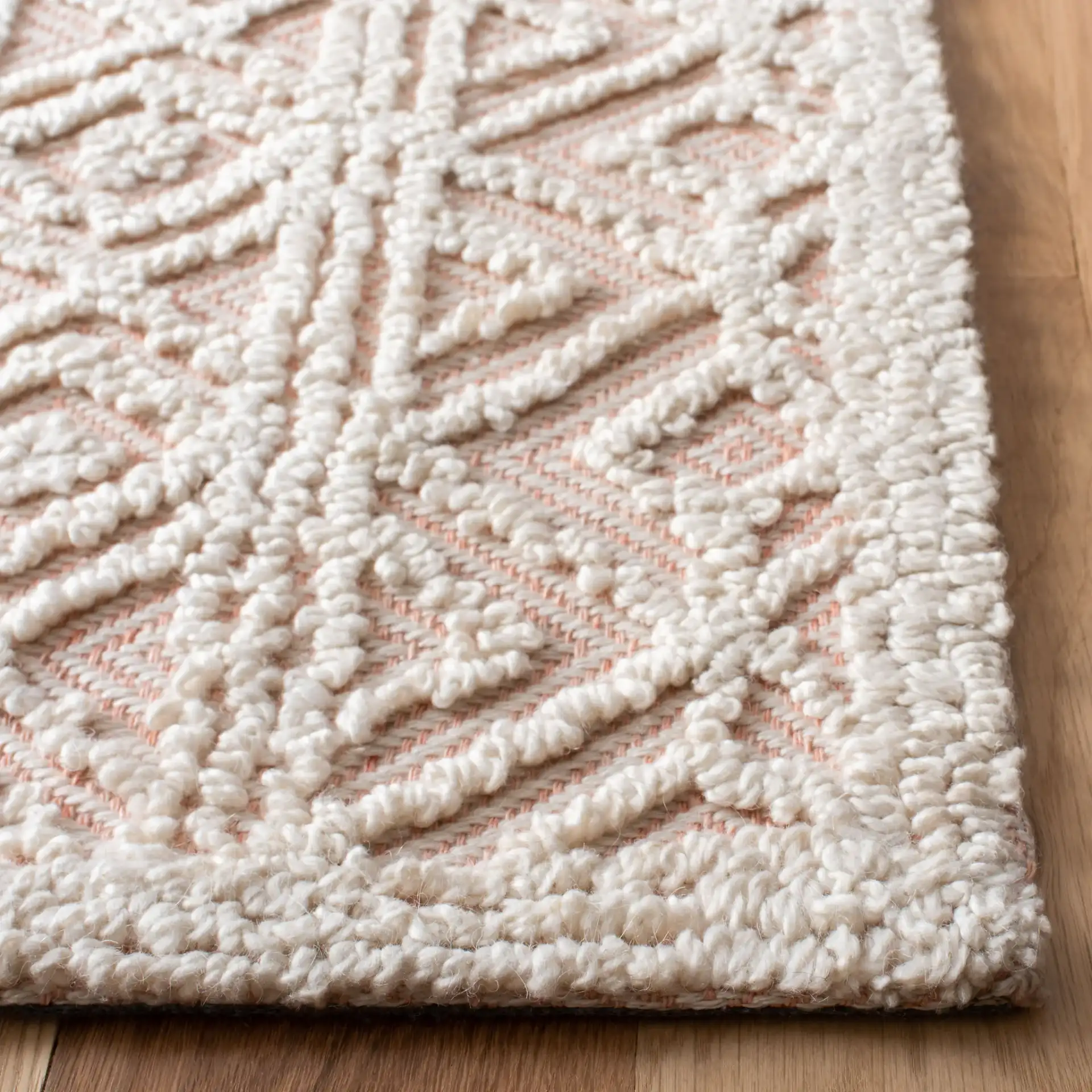 Trace Diamond Column Hand-Tufted Wool Blend Rug in Beige / Pink in a styled room
