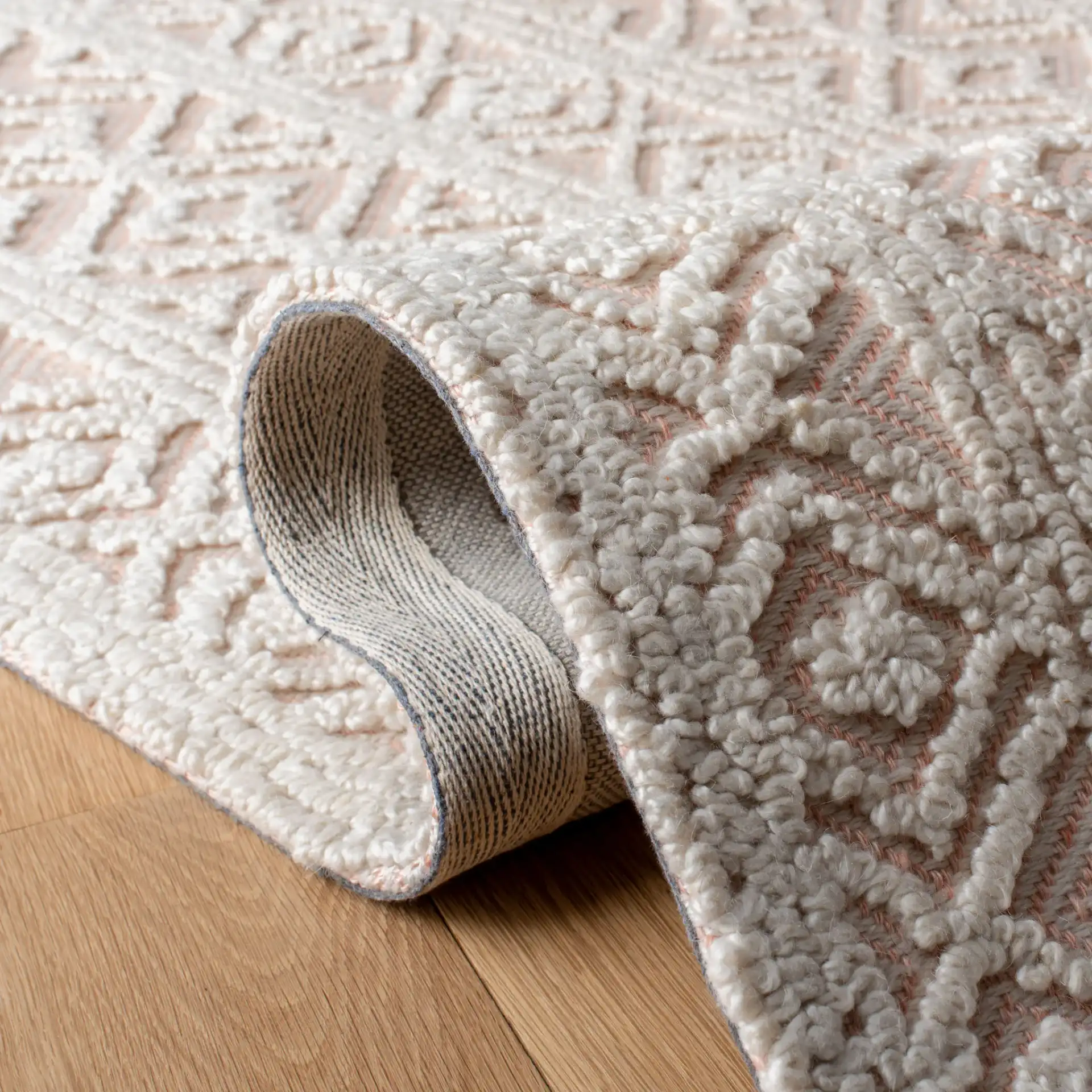 Trace Diamond Column Hand-Tufted Wool Blend Rug in Beige / Pink in a styled room