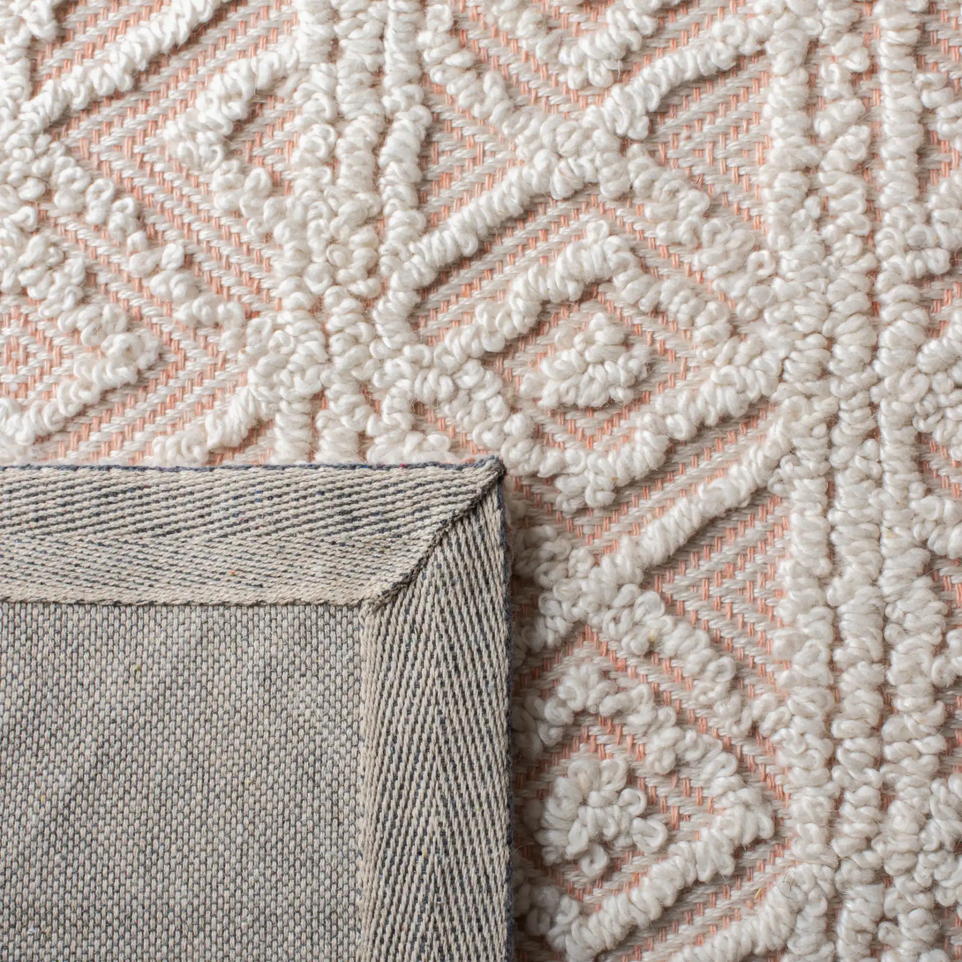Trace Diamond Column Hand-Tufted Wool Blend Rug in Beige / Pink in a styled room