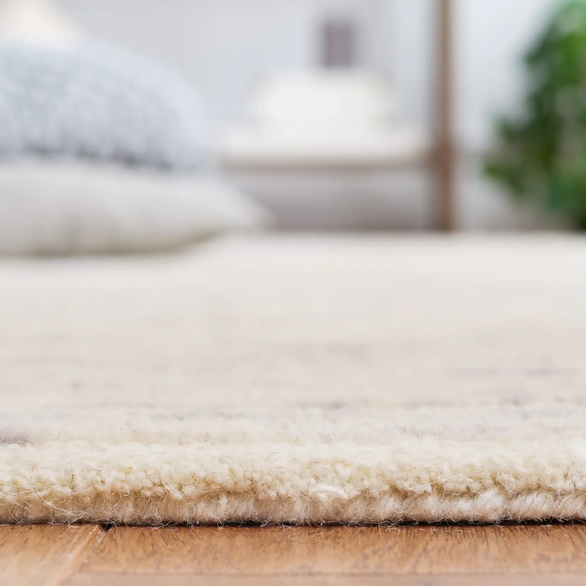 Trace Concentric Oval Hand-Tufted Wool Rug in Gray / Ivory in a styled room
