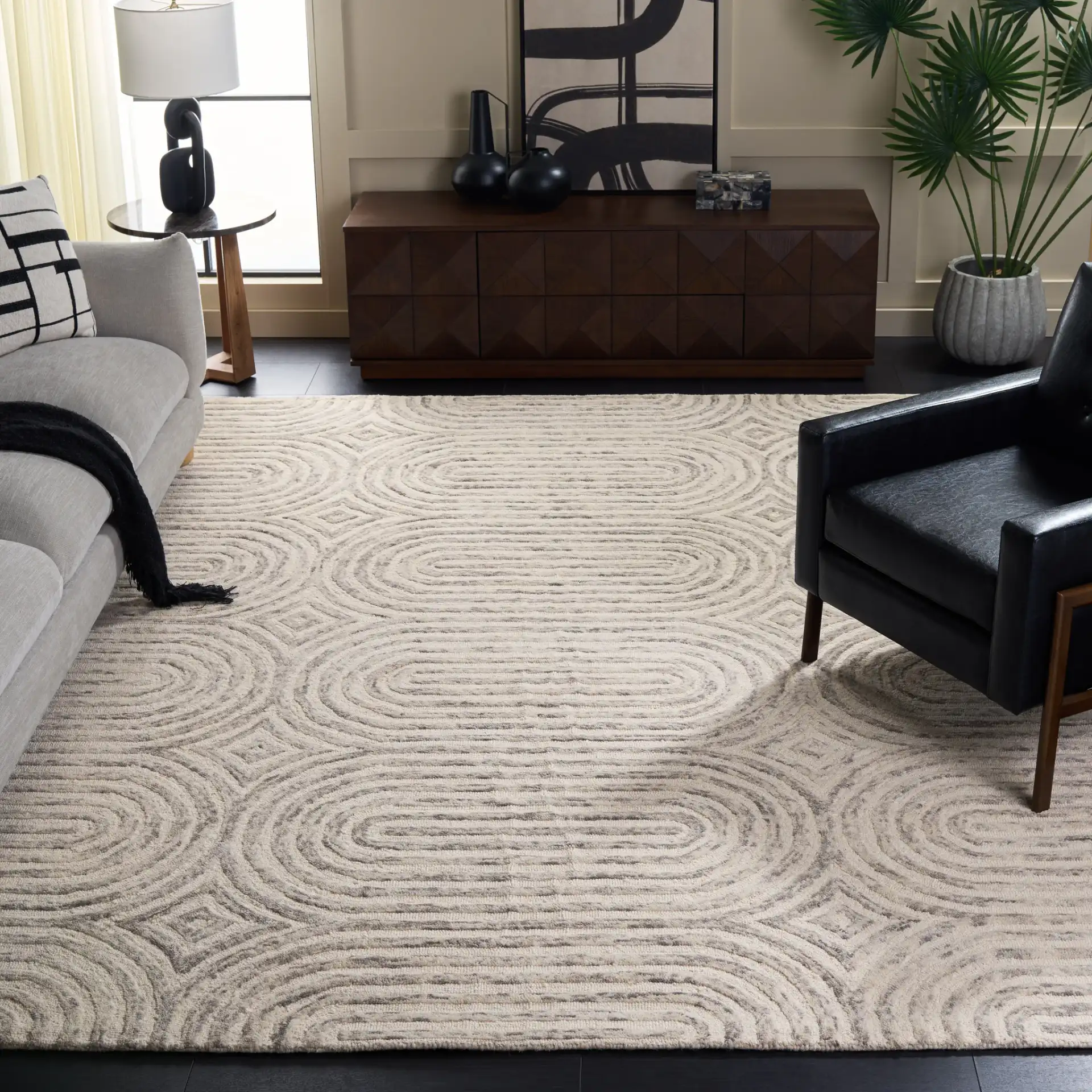 Trace Concentric Oval Hand-Tufted Wool Rug in Gray / Ivory in a styled room