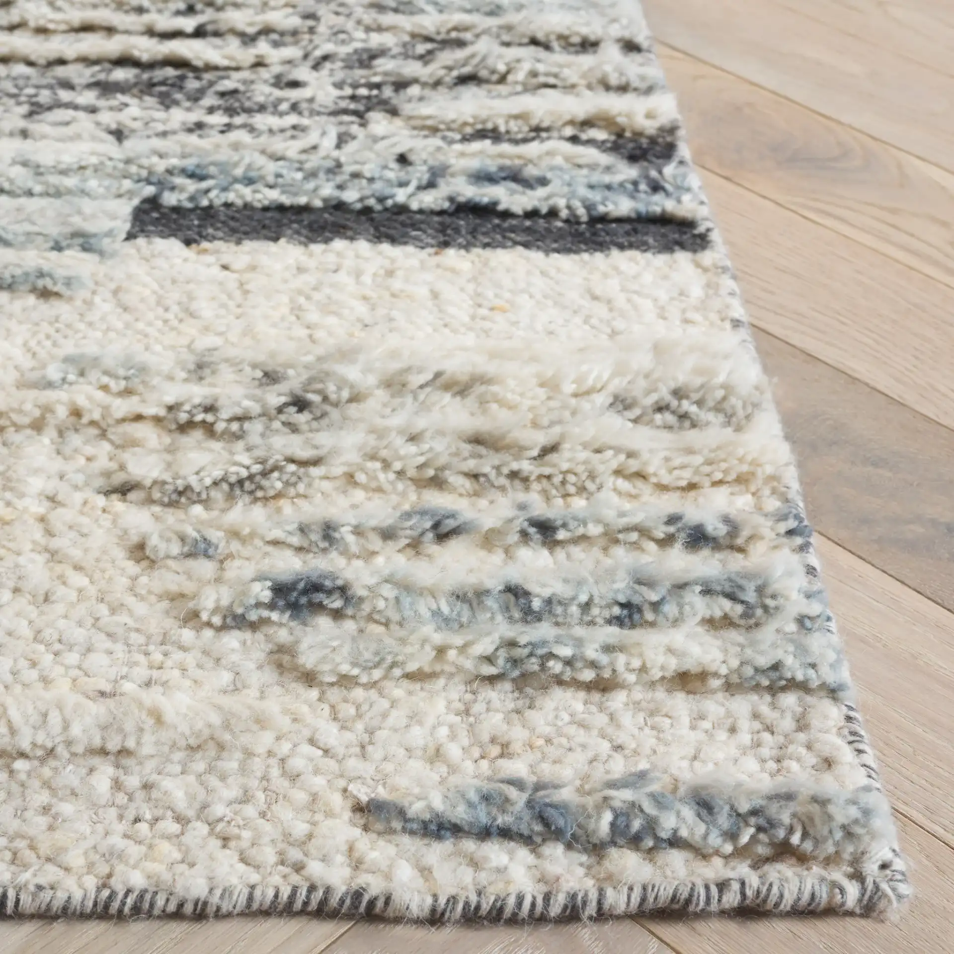 Tribeca Striated Abstract Hand-Knotted Wool Rug in Blue / Gray in a styled room