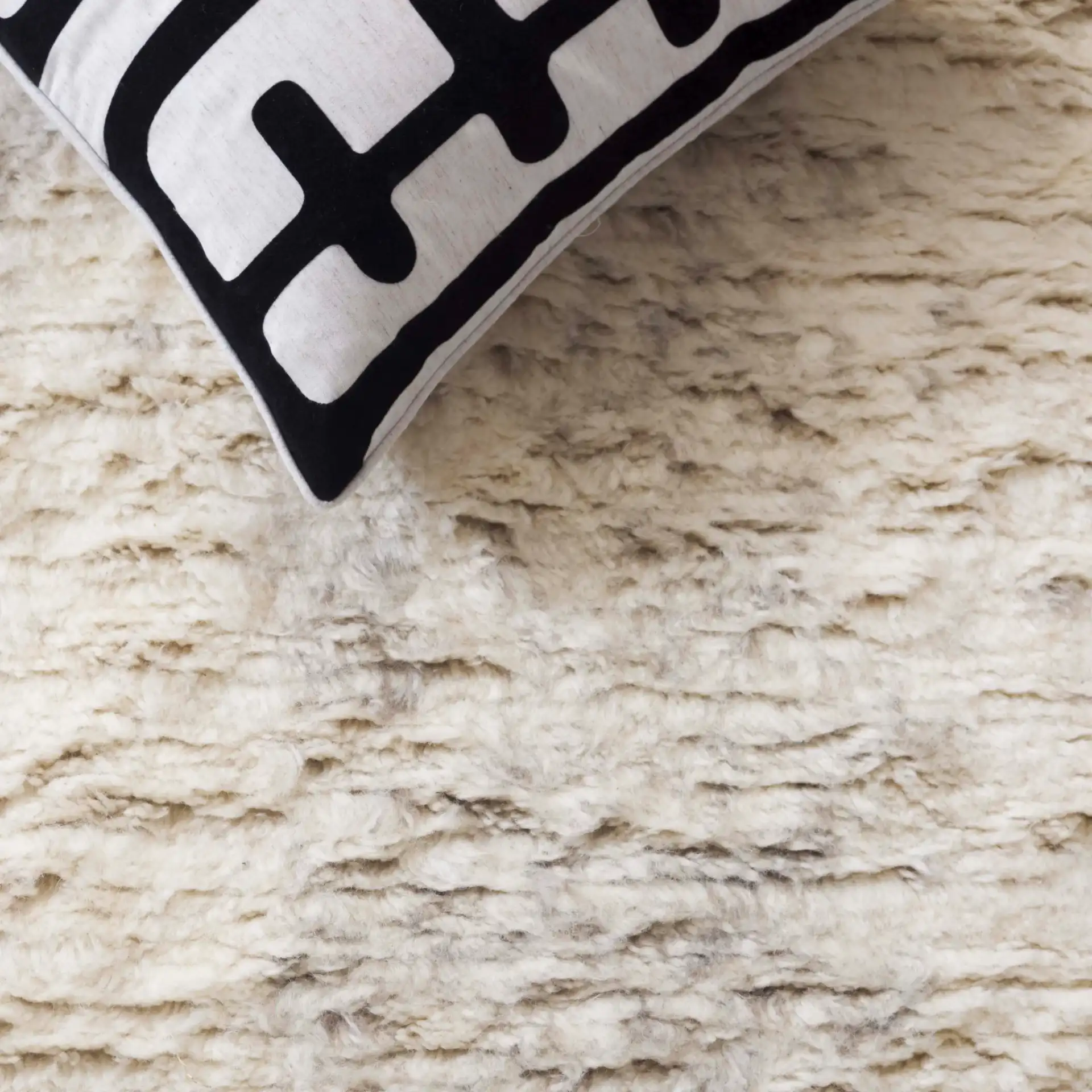 Tribeca Striated Hand-Knotted Shag Wool Rug in Gray / Beige in a styled room