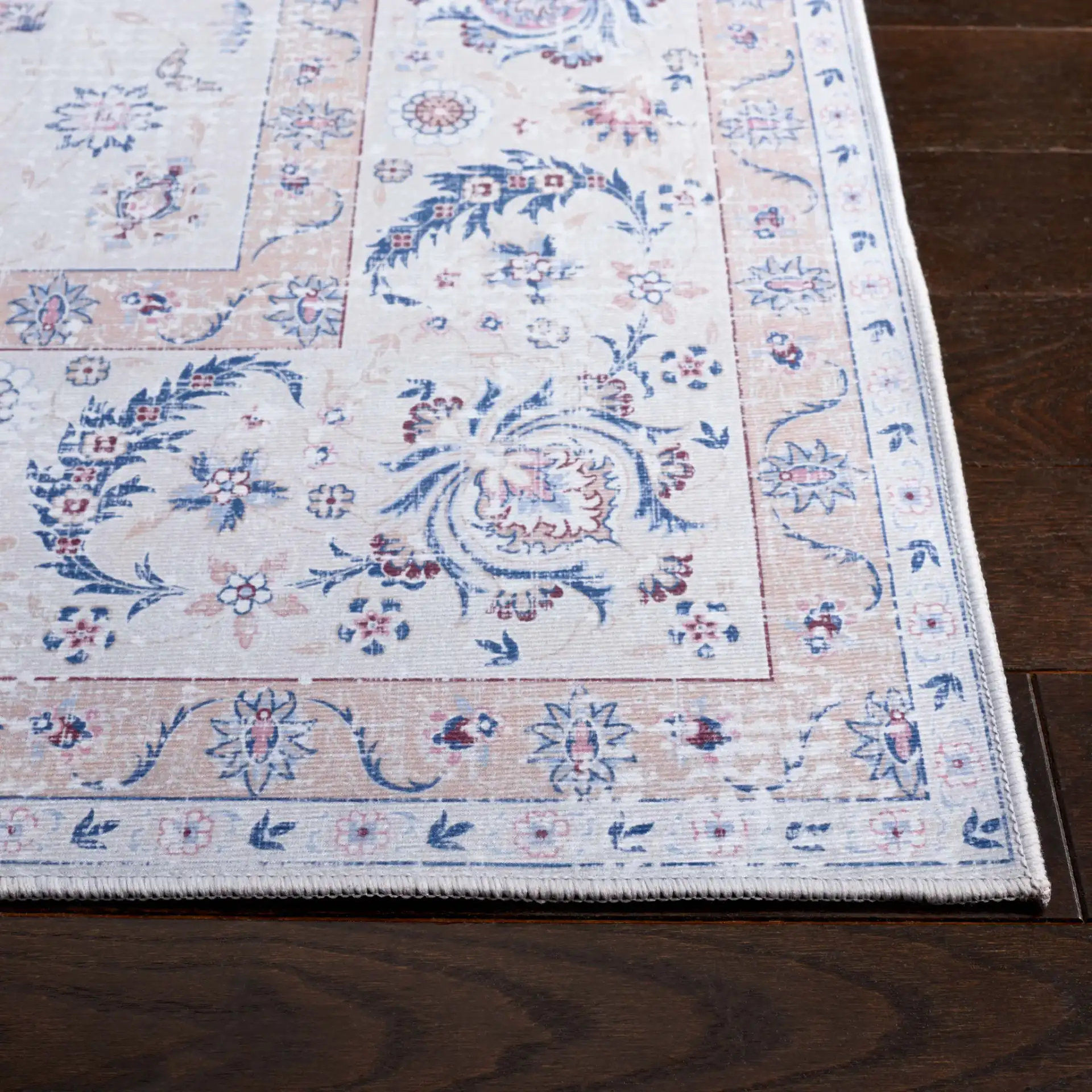 Tucson Distressed Floral Border Washable Rug in Ivory / Blue in a styled room
