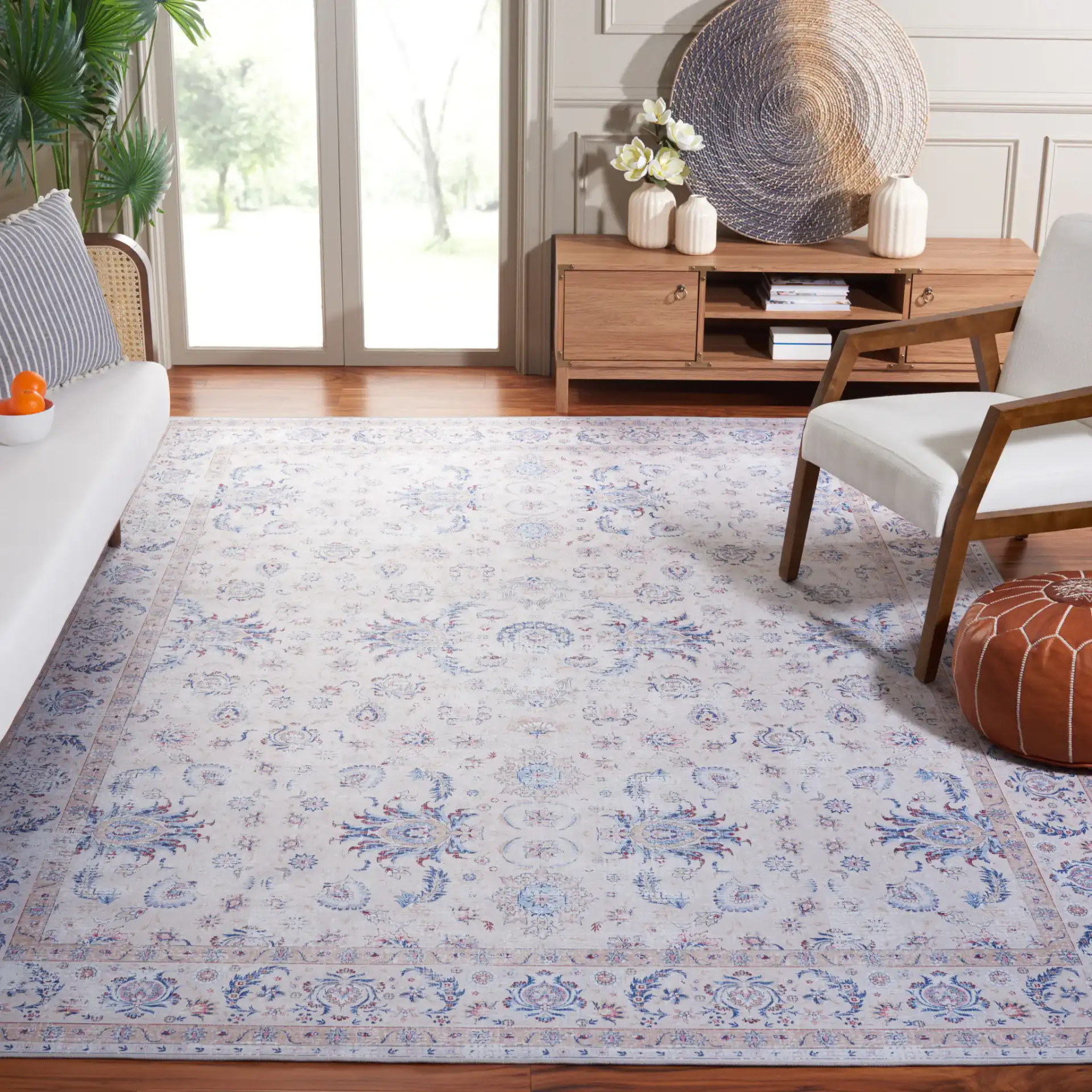 Tucson Distressed Floral Border Washable Rug in Ivory / Blue in a styled room