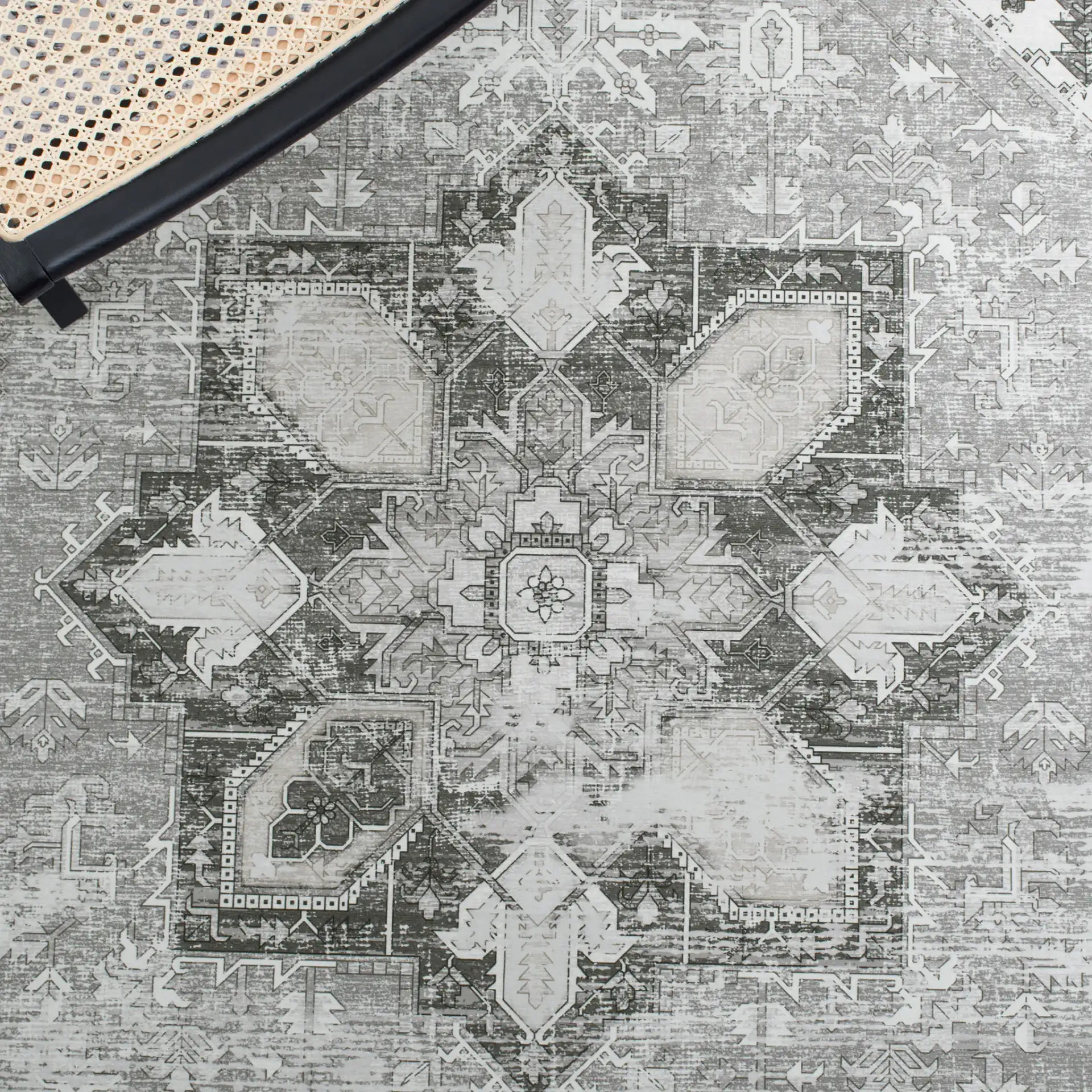 Tucson Distressed Medallion Washable Rug in Dark Sage / Ivory in a styled room