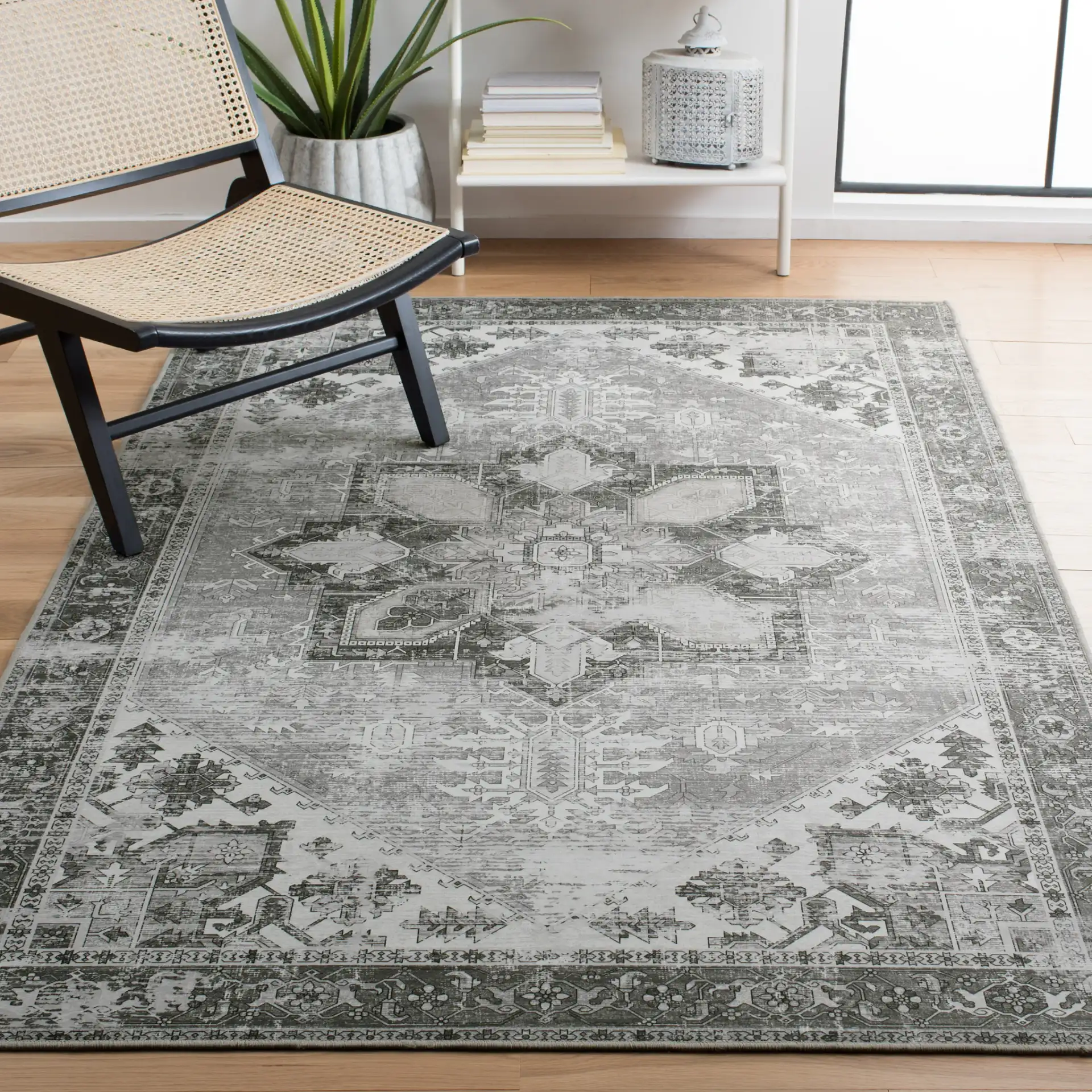 Tucson Distressed Medallion Washable Rug in Dark Sage / Ivory in a styled room