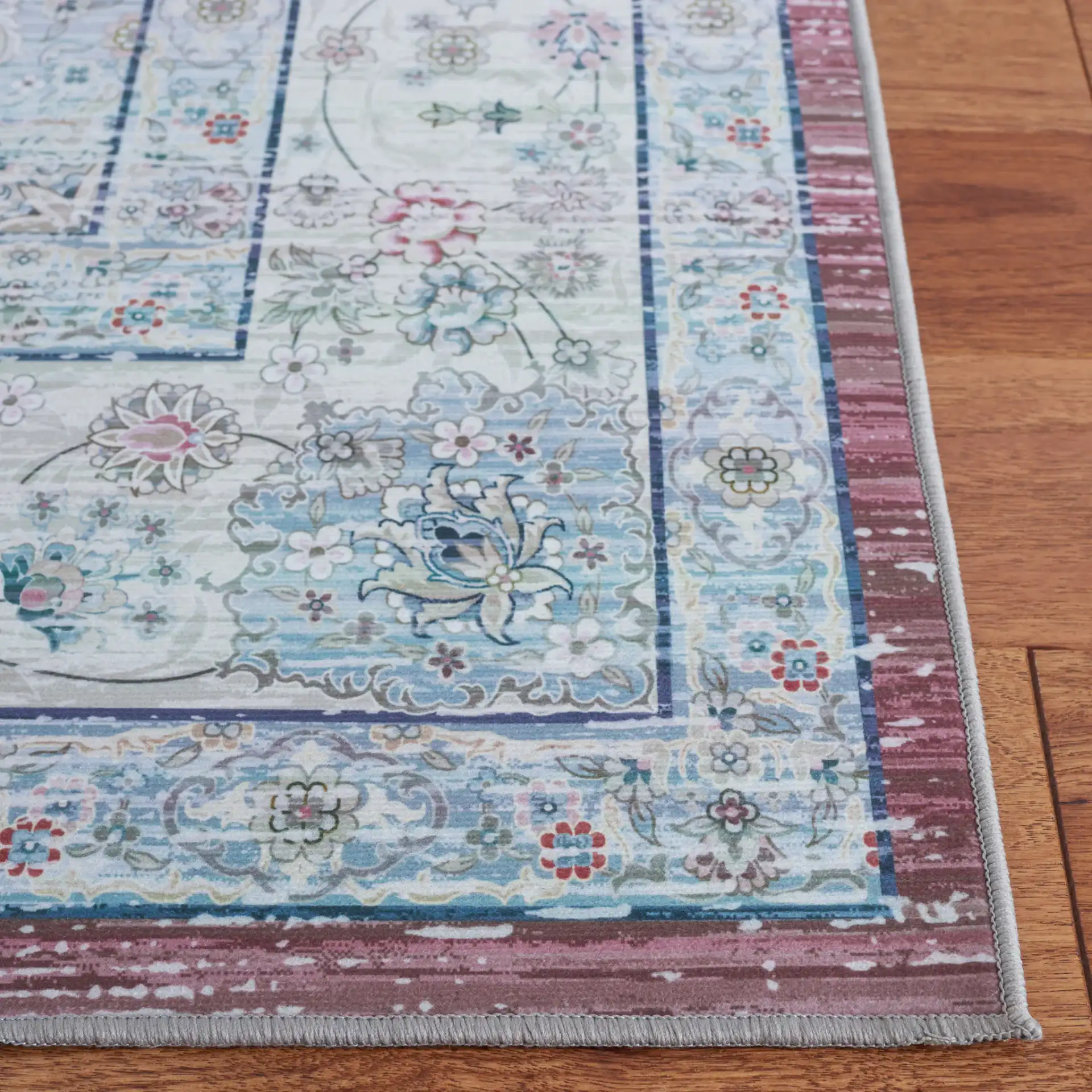 Tucson Distressed Oval Medallion Washable Rug in Rust / Beige in a styled room
