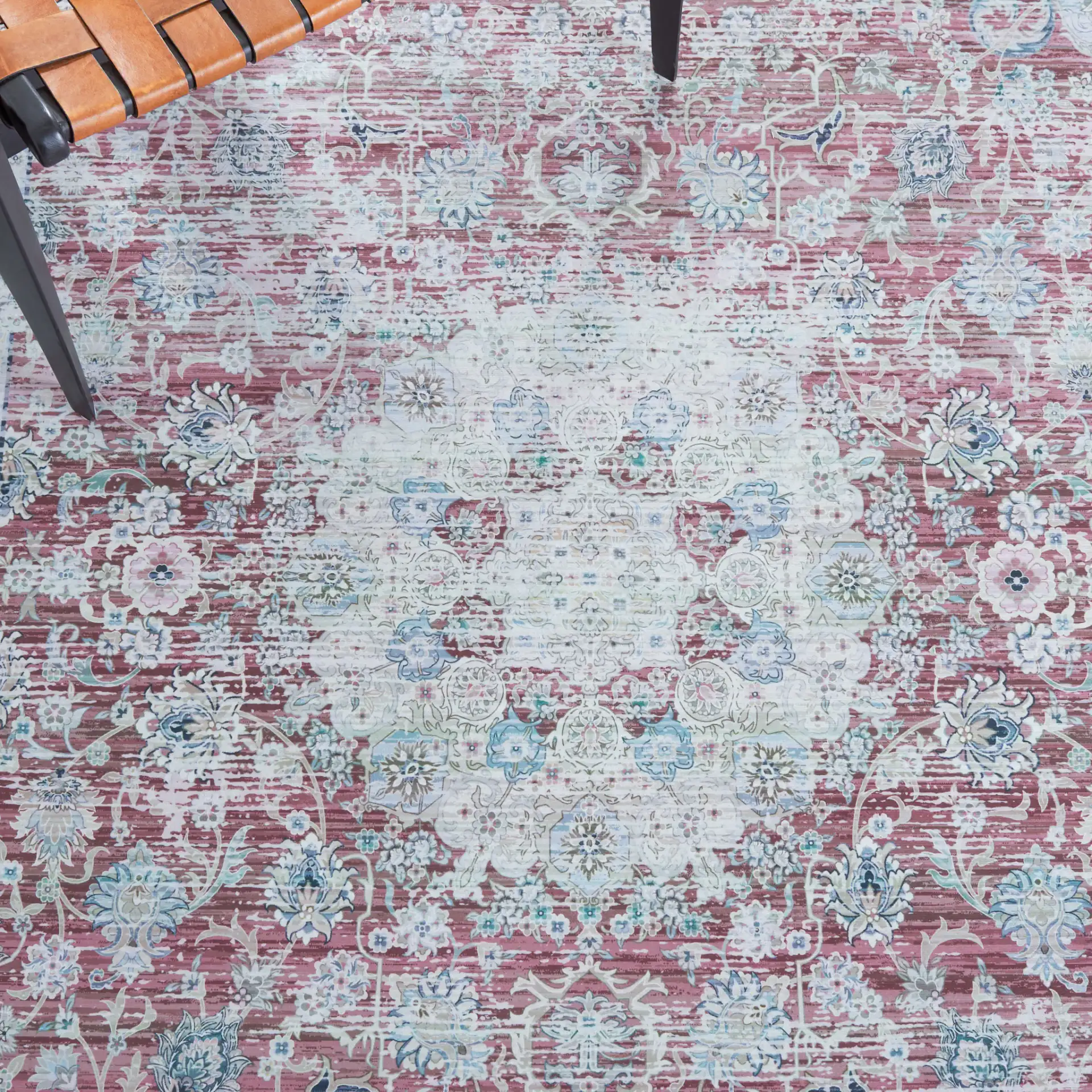 Tucson Distressed Oval Medallion Washable Rug in Rust / Beige in a styled room