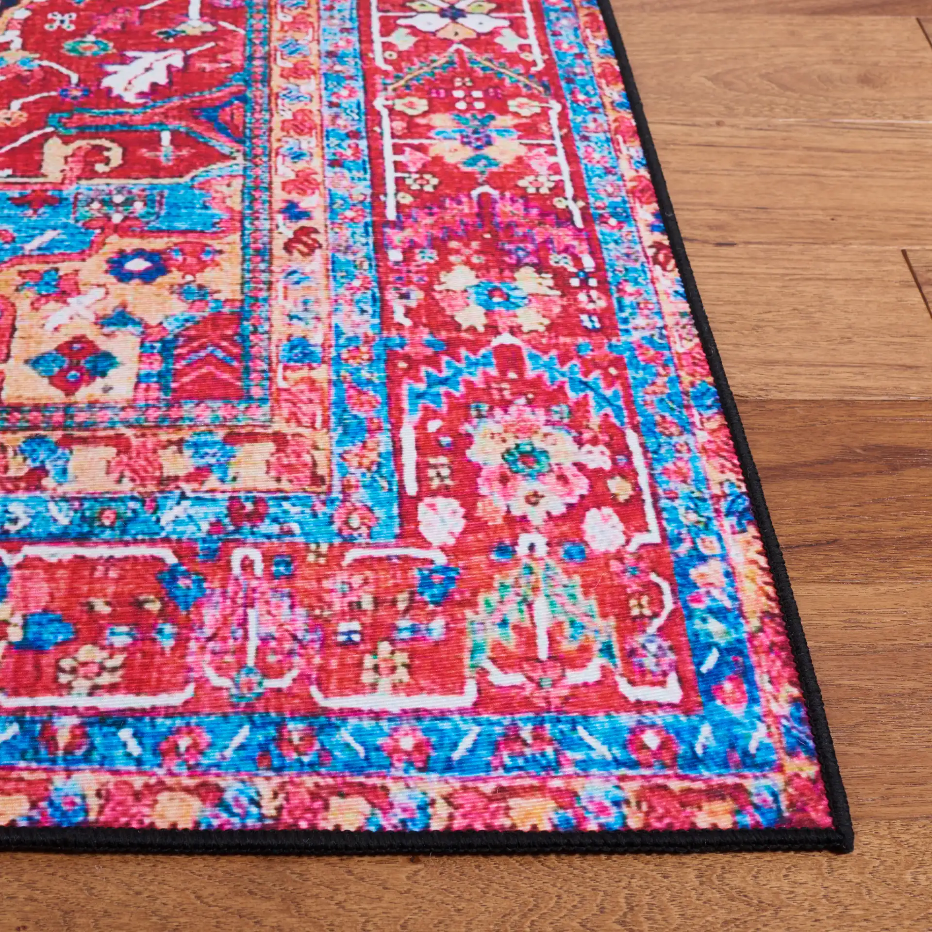 Tucson Traditional Diamond Medallion Washable Rug in Navy / Red in a styled room