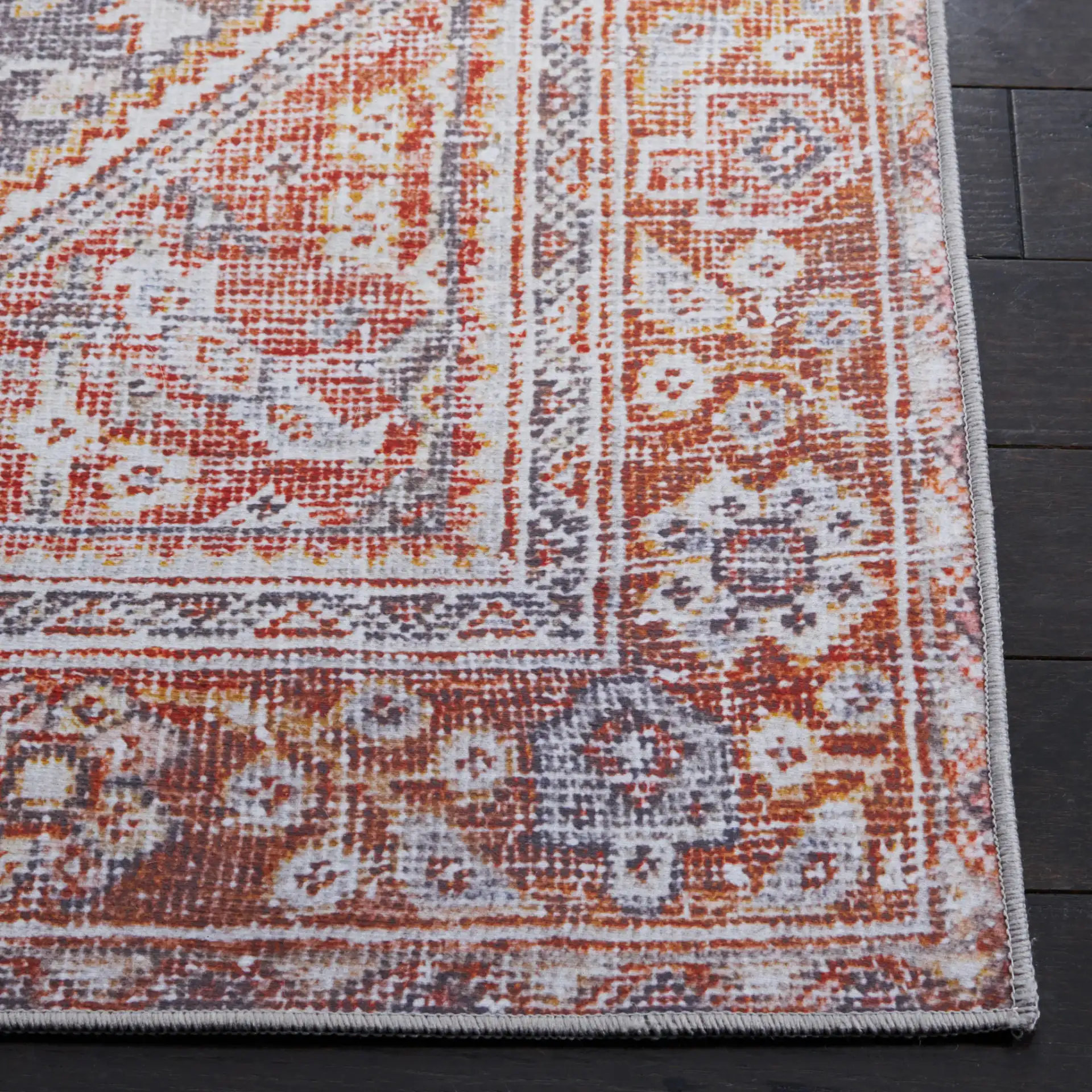Tucson Tribal Hexagon Diamond Washable Rug in Gray / Rust in a styled room
