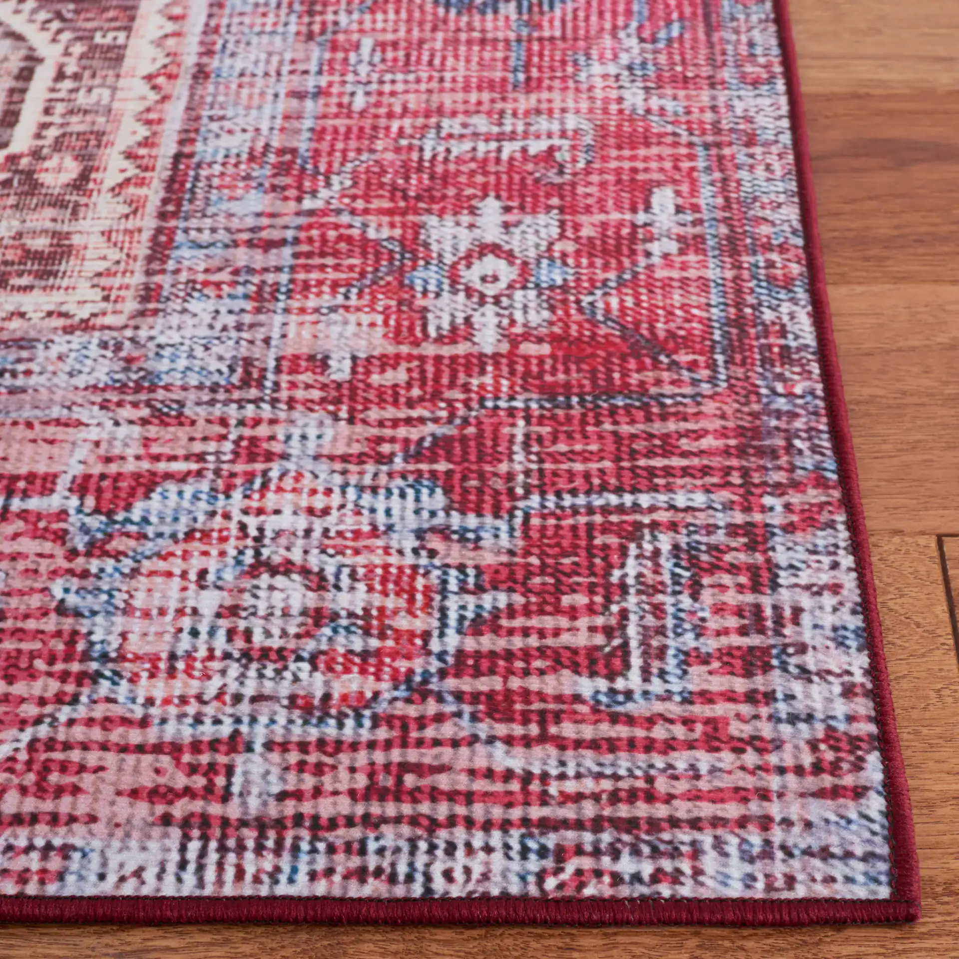 Tucson Distressed Elongated Octagon Medallion Washable Rug in Beige / Red in a styled room