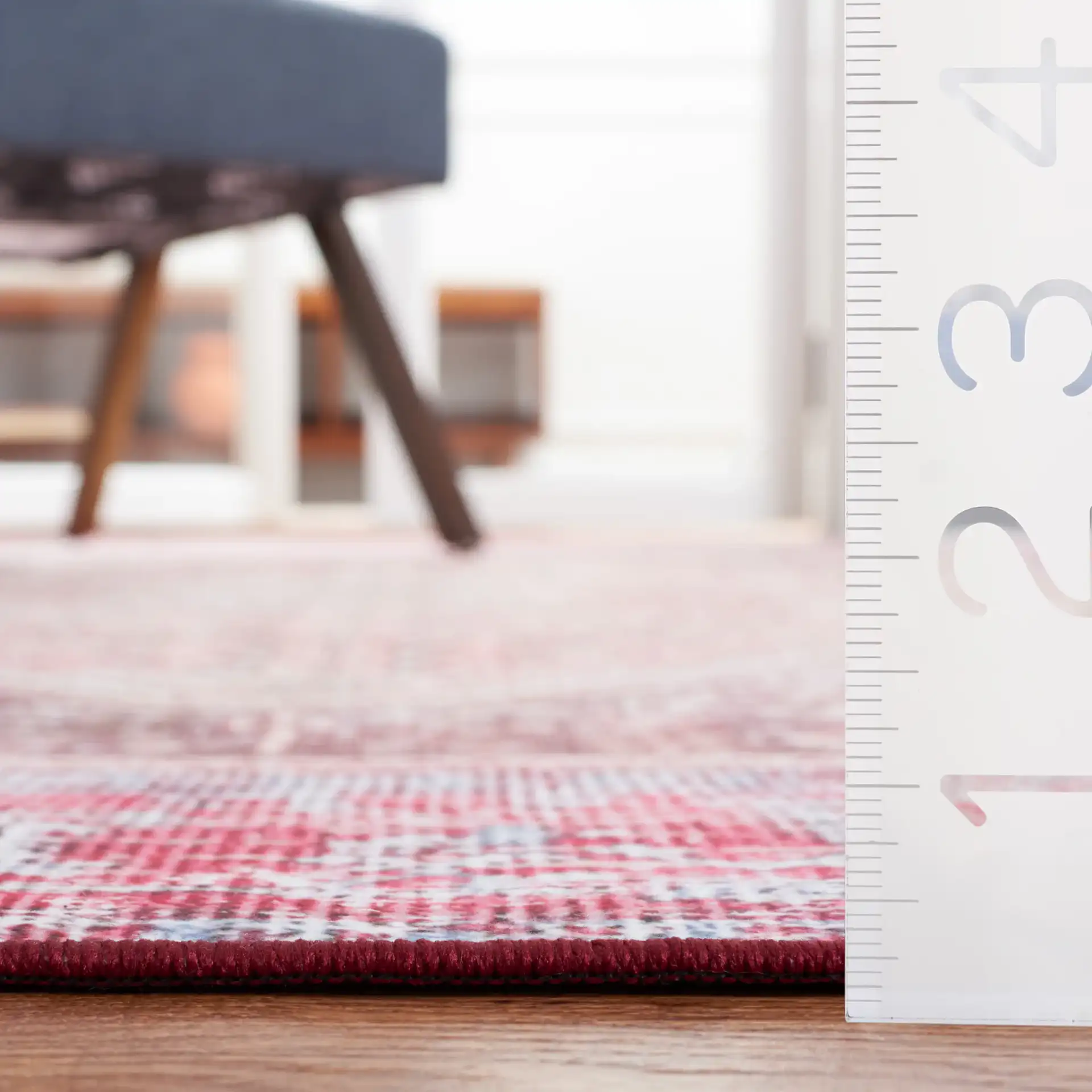 Tucson Distressed Elongated Octagon Medallion Washable Rug in Beige / Red in a styled room